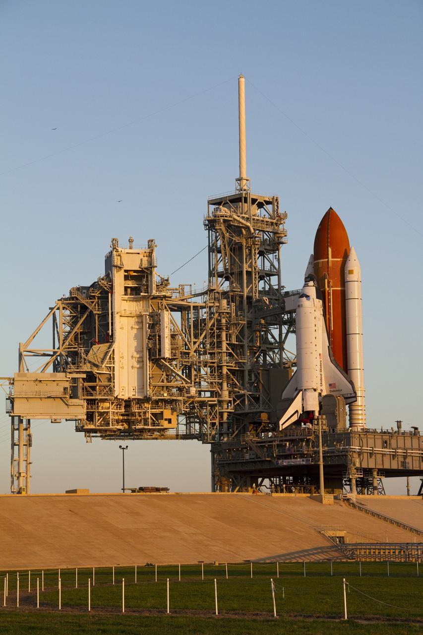 CAPE CANAVERAL, Fla. -- In the first light of day, space shuttle Endeavour stands ready for processing at Launch Pad 39A at NASA's Kennedy Space Center in Florida.    Riding atop a crawler-transporter attached to its external fuel tank and solid rocket boosters, Endeavour's 3.4-mile trek, known as "rollout," began at the Vehicle Assembly Building at 7:56 p.m. EST March 10 and ended at 3:49 a.m. EST, nearly eight hours later. This is Endeavour's final scheduled rollout.  Endeavour and its six-member crew will deliver the Express Logistics Carrier-3, Alpha Magnetic Spectrometer-2 (AMS), a high-pressure gas tank, additional spare parts for the Dextre robotic helper and micrometeoroid debris shields to the International Space Station on the shuttle's final spaceflight, STS-134. Launch is targeted for 7:48 p.m. EDT April 19. For more information, visit www.nasa.gov/mission_pages/shuttle/shuttlemissions/sts134/index.html. Photo credit: NASA/Jack Pfaller
