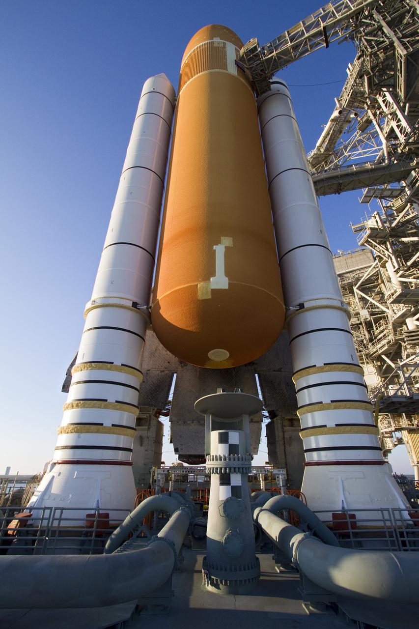CAPE CANAVERAL, Fla. -- Work platforms on the fixed service structure are positioned against space shuttle Endeavour following its arrival at Launch Pad 39A at NASA's Kennedy Space Center in Florida.    Riding atop a crawler-transporter attached to its external fuel tank and solid rocket boosters, Endeavour's 3.4-mile trek, known as "rollout," began at the Vehicle Assembly Building at 7:56 p.m. EST March 10 and ended at 3:49 a.m. EST, nearly eight hours later. This is Endeavour's final scheduled rollout.  Endeavour and its six-member crew will deliver the Express Logistics Carrier-3, Alpha Magnetic Spectrometer-2 (AMS), a high-pressure gas tank, additional spare parts for the Dextre robotic helper and micrometeoroid debris shields to the International Space Station on the shuttle's final spaceflight, STS-134. Launch is targeted for 7:48 p.m. EDT April 19. For more information, visit www.nasa.gov/mission_pages/shuttle/shuttlemissions/sts134/index.html. Photo credit: NASA/Jack Pfaller