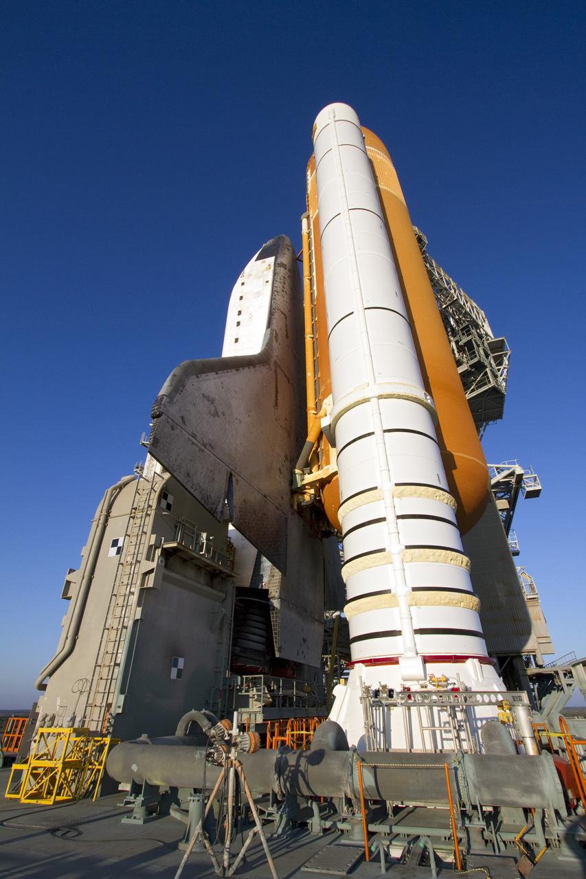 CAPE CANAVERAL, Fla. -- Four attach posts on each of two solid rocket boosters secure space shuttle Endeavour to its mobile launcher platform at Launch Pad 39A at NASA's Kennedy Space Center in Florida.    Riding atop a crawler-transporter attached to its external fuel tank and solid rocket boosters, Endeavour's 3.4-mile trek, known as "rollout," began at the Vehicle Assembly Building at 7:56 p.m. EST March 10 and ended at 3:49 a.m. EST, nearly eight hours later. This is Endeavour's final scheduled rollout.  Endeavour and its six-member crew will deliver the Express Logistics Carrier-3, Alpha Magnetic Spectrometer-2 (AMS), a high-pressure gas tank, additional spare parts for the Dextre robotic helper and micrometeoroid debris shields to the International Space Station on the shuttle's final spaceflight, STS-134. Launch is targeted for 7:48 p.m. EDT April 19. For more information, visit www.nasa.gov/mission_pages/shuttle/shuttlemissions/sts134/index.html. Photo credit: NASA/Jack Pfaller