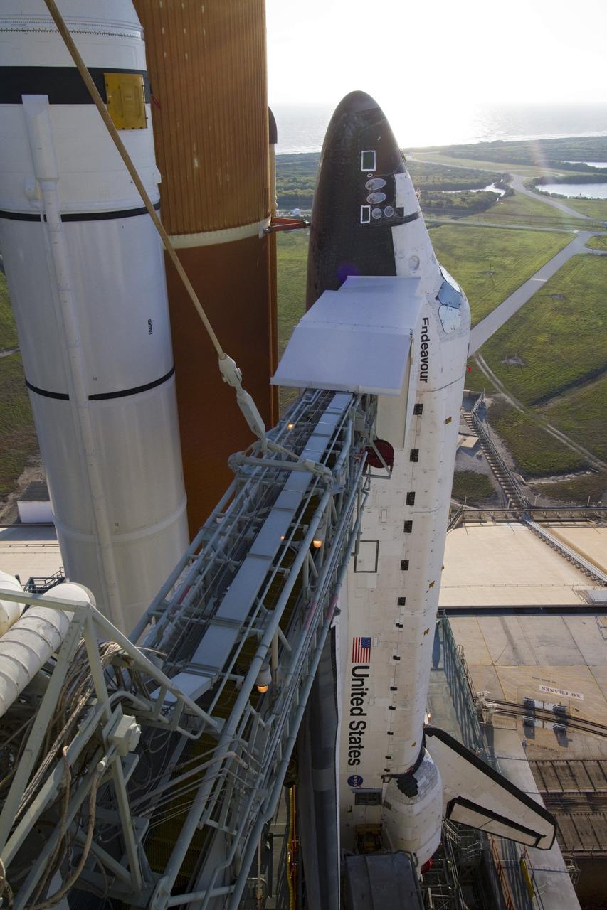 CAPE CANAVERAL, Fla. -- Space shuttle Endeavour is newly arrived at Launch Pad 39A near the Atlantic seashore at NASA's Kennedy Space Center in Florida.    Riding atop a crawler-transporter attached to its external fuel tank and solid rocket boosters, Endeavour's 3.4-mile trek, known as "rollout," began at the Vehicle Assembly Building at 7:56 p.m. EST March 10 and ended at 3:49 a.m. EST, nearly eight hours later. This is Endeavour's final scheduled rollout.  Endeavour and its six-member crew will deliver the Express Logistics Carrier-3, Alpha Magnetic Spectrometer-2 (AMS), a high-pressure gas tank, additional spare parts for the Dextre robotic helper and micrometeoroid debris shields to the International Space Station on the shuttle's final spaceflight, STS-134. Launch is targeted for 7:48 p.m. EDT April 19. For more information, visit www.nasa.gov/mission_pages/shuttle/shuttlemissions/sts134/index.html. Photo credit: NASA/Jack Pfaller