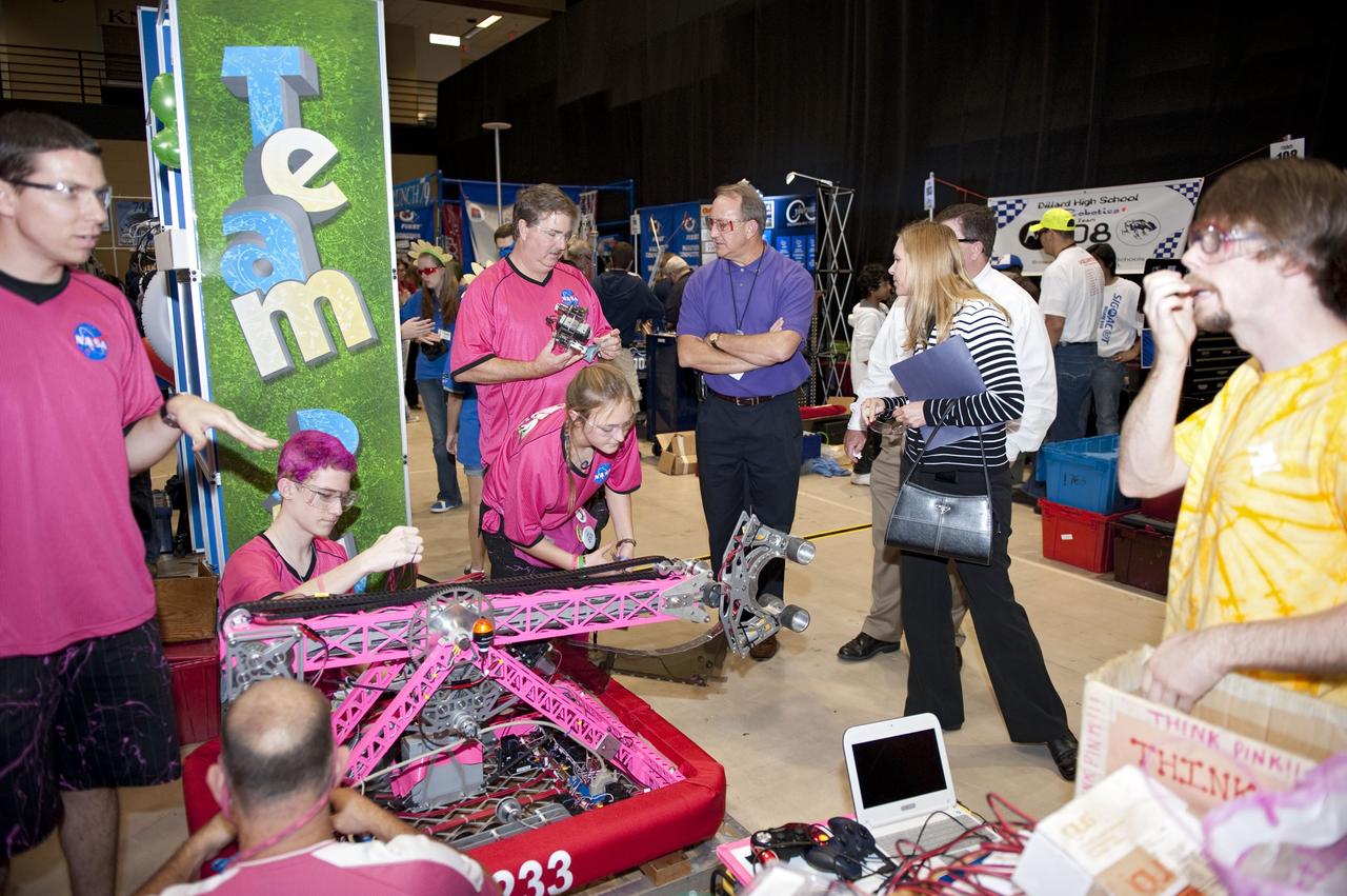 ORLANDO, Fla. – The Pink Team participates in the regional FIRST robotics competition at the University of Central Florida in Orlando. The team is made up of students from Rockledge, Cocoa Beach and Viera high schools along the Space Coast of Florida. NASA’s Kennedy Space Center is a sponsor of the team. The Pink Team finished sixth in the competition called "For Inspiration and Recognition of Science and Technology," or FIRST, among about 60 high school teams hoping to advance to the national robotics championship. The team also took home the Industrial Design Award sponsored by General Motors. Kennedy's Deputy Director Janet Petro and Engineering Director Pat Simpkins also stopped by the competition to encourage the teams. FIRST, founded in 1989, is a non-profit organization that designs accessible, innovative programs to build self-confidence, knowledge and life skills while motivating young people to pursue academic opportunities. The robotics competition challenges teams of high school students and their mentors to solve a common problem in a six-week timeframe using a standard kit of parts and a common set of rules. Photo credit: NASA/Glenn Benson