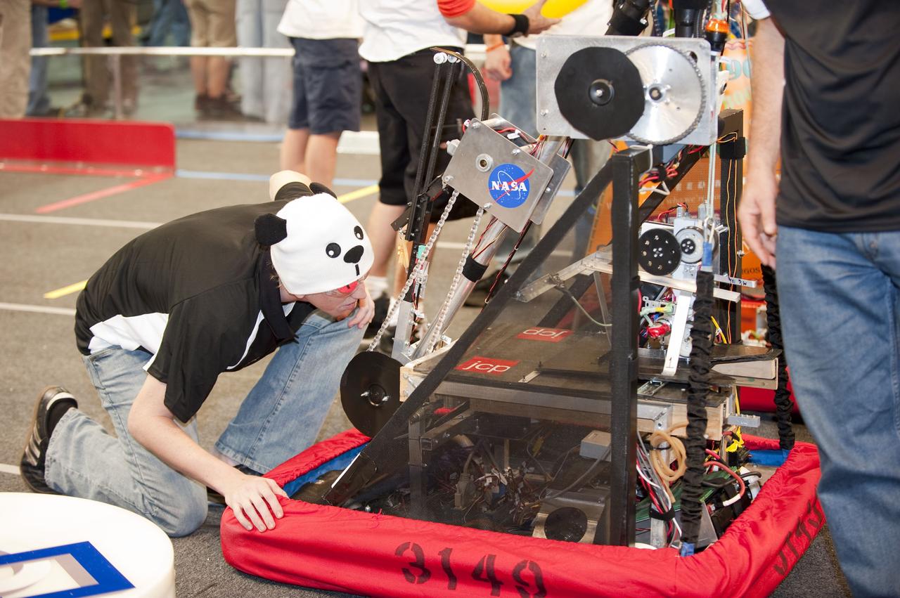 ORLANDO, Fla. – Team 3149 participates in the regional FIRST robotics competition at the University of Central Florida in Orlando. The team is made up of students from McKeel Academy of Technology in Lakeland, Fla. NASA is a sponsor of the team. Team 3149 finished eighth in the competition called "For Inspiration and Recognition of Science and Technology," or FIRST, among about 60 high school teams hoping to advance to the national robotics championship. FIRST, founded in 1989, is a non-profit organization that designs accessible, innovative programs to build self-confidence, knowledge and life skills while motivating young people to pursue academic opportunities. The robotics competition challenges teams of high school students and their mentors to solve a common problem in a six-week timeframe using a standard kit of parts and a common set of rules. Photo credit: NASA/Glenn Benson