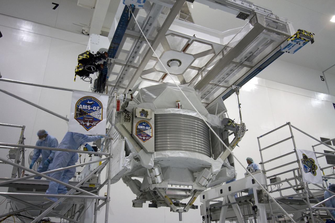 CAPE CANAVERAL, Fla. -- In the Space Station Processing Facility at NASA's Kennedy Space Center in Florida, the Alpha Magnetic Spectrometer-2 (AMS) moves from its primary work stand to the weight and center of gravity stand where final measurements will be taken before launch. Next, AMS will be moved into a payload canister. The canister will protect the space-bound payload on its journey to Launch Pad 39A, where it will later be installed into space shuttle Endeavour’s payload bay. AMS is a particle physics detector, designed to operate as an external experiment on the International Space Station. It will use the unique environment of space to study the universe and its origin by searching for dark matter. AMS-2 will fly to the station aboard Endeavour's STS-134 mission targeted to launch April 19 at 7:48 p.m. EDT. For more information visit, www.nasa.gov/mission_pages/shuttle/shuttlemissions/sts134/index.html. Photo credit: NASA/Jack Pfaller