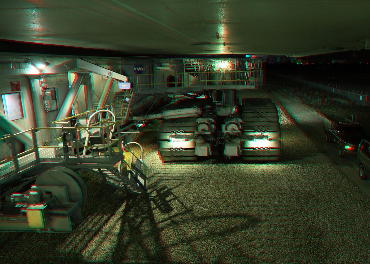 CAPE CANAVERAL, Fla. -- This is a 3-D image of the crawler-transporter as it slowly hauls space shuttle Endeavour from the Vehicle Assembly Building to Launch Pad 39A at NASA’s Kennedy Space Center in Florida. The gigantic tracked mover weighs about 18 million pounds with the space shuttle, two solid rocket boosters, external fuel tank and mobile launcher platform attached. It takes six to eight hours to complete the 3.4-mile trip along crushed Alabama river rock at a speed of about 1 mph. To view this image, use green and magenta 3-D glasses. Endeavour and its six-member STS-134 crew will deliver the Express Logistics Carrier-3, Alpha Magnetic Spectrometer-2 (AMS), a high-pressure gas tank, additional spare parts for the Dextre robotic helper and micrometeoroid debris shields to the International Space Station. Endeavour's final launch is targeted for April 19 at 7:48 p.m. EDT. For more information visit, http://www.nasa.gov/mission_pages/shuttle/shuttlemissions/sts134/index.html. Photo credit: NASA/Frankie Martin