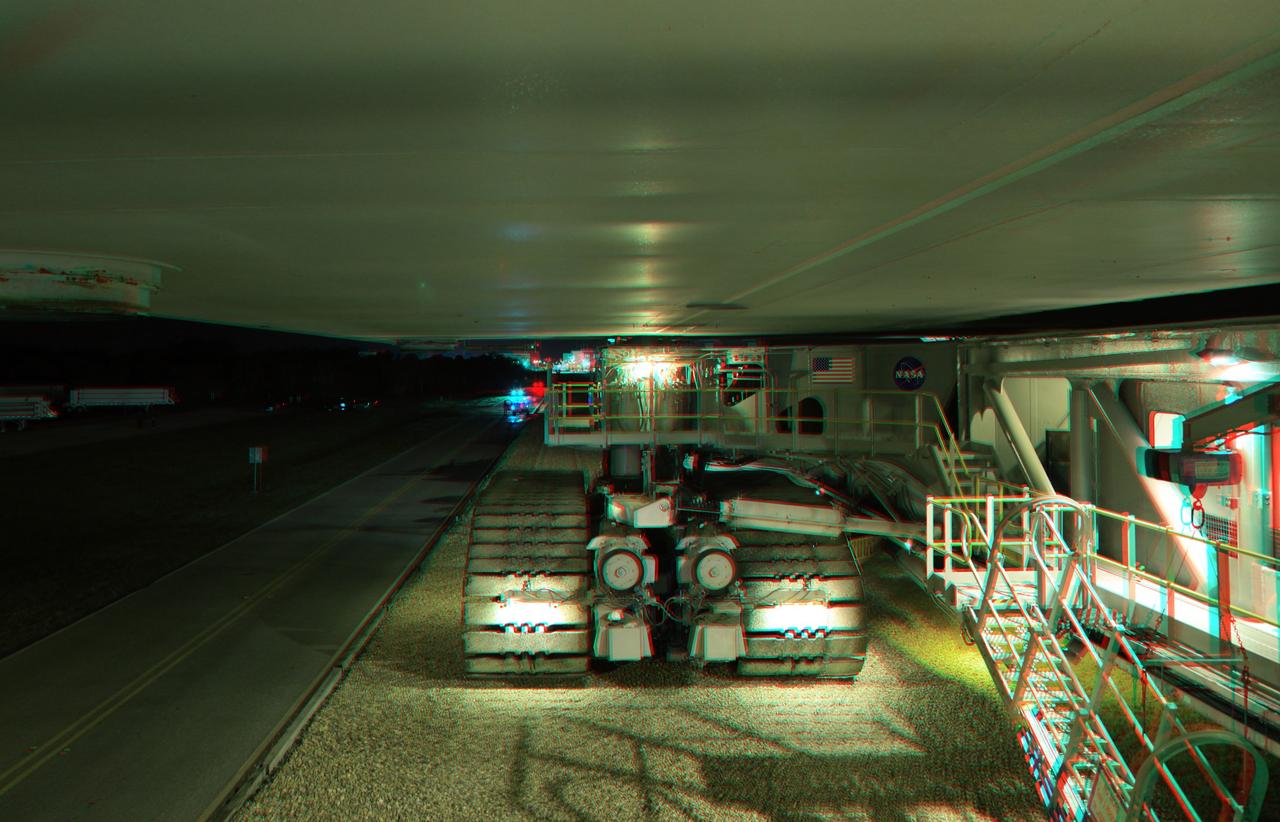 CAPE CANAVERAL, Fla. -- This is a 3-D image of the crawler-transporter as it slowly hauls space shuttle Endeavour from the Vehicle Assembly Building to Launch Pad 39A at NASA’s Kennedy Space Center in Florida. The gigantic tracked mover weighs about 18 million pounds with the space shuttle, two solid rocket boosters, external fuel tank and mobile launcher platform attached. It takes six to eight hours to complete the 3.4-mile trip along crushed Alabama river rock at a speed of about 1 mph. To view this image, use green and magenta 3-D glasses. Endeavour and its six-member STS-134 crew will deliver the Express Logistics Carrier-3, Alpha Magnetic Spectrometer-2 (AMS), a high-pressure gas tank, additional spare parts for the Dextre robotic helper and micrometeoroid debris shields to the International Space Station. Endeavour's final launch is targeted for April 19 at 7:48 p.m. EDT. For more information visit, http://www.nasa.gov/mission_pages/shuttle/shuttlemissions/sts134/index.html. Photo credit: NASA/Frankie Martin