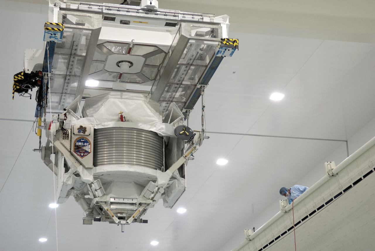 CAPE CANAVERAL, Fla. -- In the Space Station Processing Facility at NASA's Kennedy Space Center in Florida, the Alpha Magnetic Spectrometer-2 (AMS) is moved from the weight and center of gravity stand, where final measurements were taken before launch, to a payload canister. The canister will protect the space-bound payload on its journey to Launch Pad 39A, where it will later be installed into space shuttle Endeavour’s payload bay. AMS is a particle physics detector, designed to operate as an external experiment on the International Space Station. It will use the unique environment of space to study the universe and its origin by searching for dark matter. AMS-2 will fly to the station aboard Endeavour's STS-134 mission targeted to launch April 19 at 7:48 p.m. EDT. For more information visit, www.nasa.gov/mission_pages/shuttle/shuttlemissions/sts134/index.html. Photo credit: NASA/Jim Grossmann