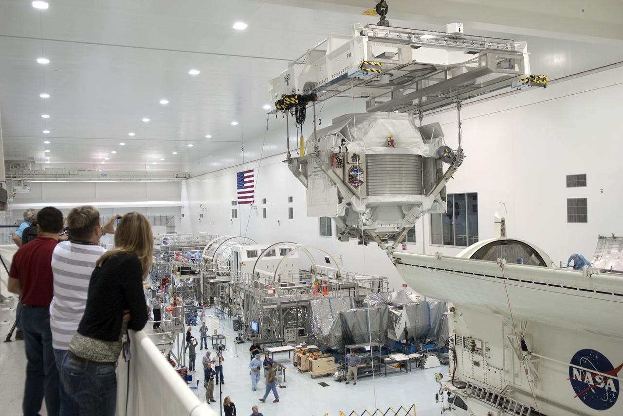 CAPE CANAVERAL, Fla. -- In the Space Station Processing Facility at NASA's Kennedy Space Center in Florida, the Alpha Magnetic Spectrometer-2 (AMS) is moved from the weight and center of gravity stand, where final measurements were taken before launch, to a payload canister. The canister will protect the space-bound payload on its journey to Launch Pad 39A, where it will later be installed into space shuttle Endeavour’s payload bay. AMS is a particle physics detector, designed to operate as an external experiment on the International Space Station. It will use the unique environment of space to study the universe and its origin by searching for dark matter. AMS-2 will fly to the station aboard Endeavour's STS-134 mission targeted to launch April 19 at 7:48 p.m. EDT. For more information visit, www.nasa.gov/mission_pages/shuttle/shuttlemissions/sts134/index.html. Photo credit: NASA/Jim Grossmann