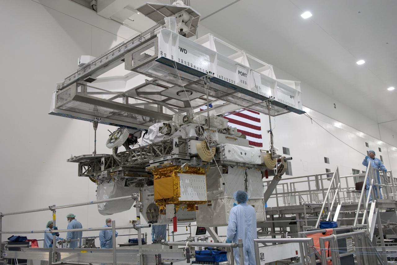 CAPE CANAVERAL, Fla. -- In the Space Station Processing Facility at NASA's Kennedy Space Center in Florida, Express Logistics Carrier-3 is moved from its primary work stand to a payload canister. The canister will protect the space-bound payload on its journey to Launch Pad 39A, where it will later be installed into space shuttle Endeavour’s payload bay. ELC-3 is packed with a variety of spare parts for the International Space Station, including two S-band communications antennas, a high-pressure gas tank, additional spare parts for Dextre and micrometeoroid debris shields. ELC-3 will fly to the station aboard Endeavour's STS-134 mission targeted to launch April 19 at 7:48 p.m. EDT. For more information visit, www.nasa.gov/mission_pages/shuttle/shuttlemissions/sts134/index.html. Photo credit: NASA/Jim Grossmann