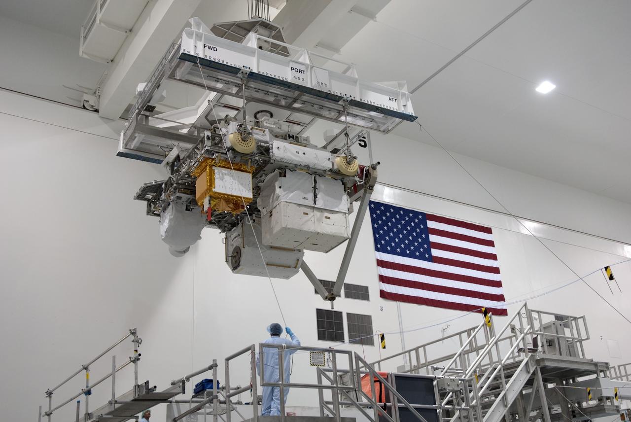 CAPE CANAVERAL, Fla. -- In the Space Station Processing Facility at NASA's Kennedy Space Center in Florida, Express Logistics Carrier-3 is moved from its primary work stand to a payload canister. The canister will protect the space-bound payload on its journey to Launch Pad 39A, where it will later be installed into space shuttle Endeavour’s payload bay. ELC-3 is packed with a variety of spare parts for the International Space Station, including two S-band communications antennas, a high-pressure gas tank, additional spare parts for Dextre and micrometeoroid debris shields. ELC-3 will fly to the station aboard Endeavour's STS-134 mission targeted to launch April 19 at 7:48 p.m. EDT. For more information visit, www.nasa.gov/mission_pages/shuttle/shuttlemissions/sts134/index.html. Photo credit: NASA/Jim Grossmann