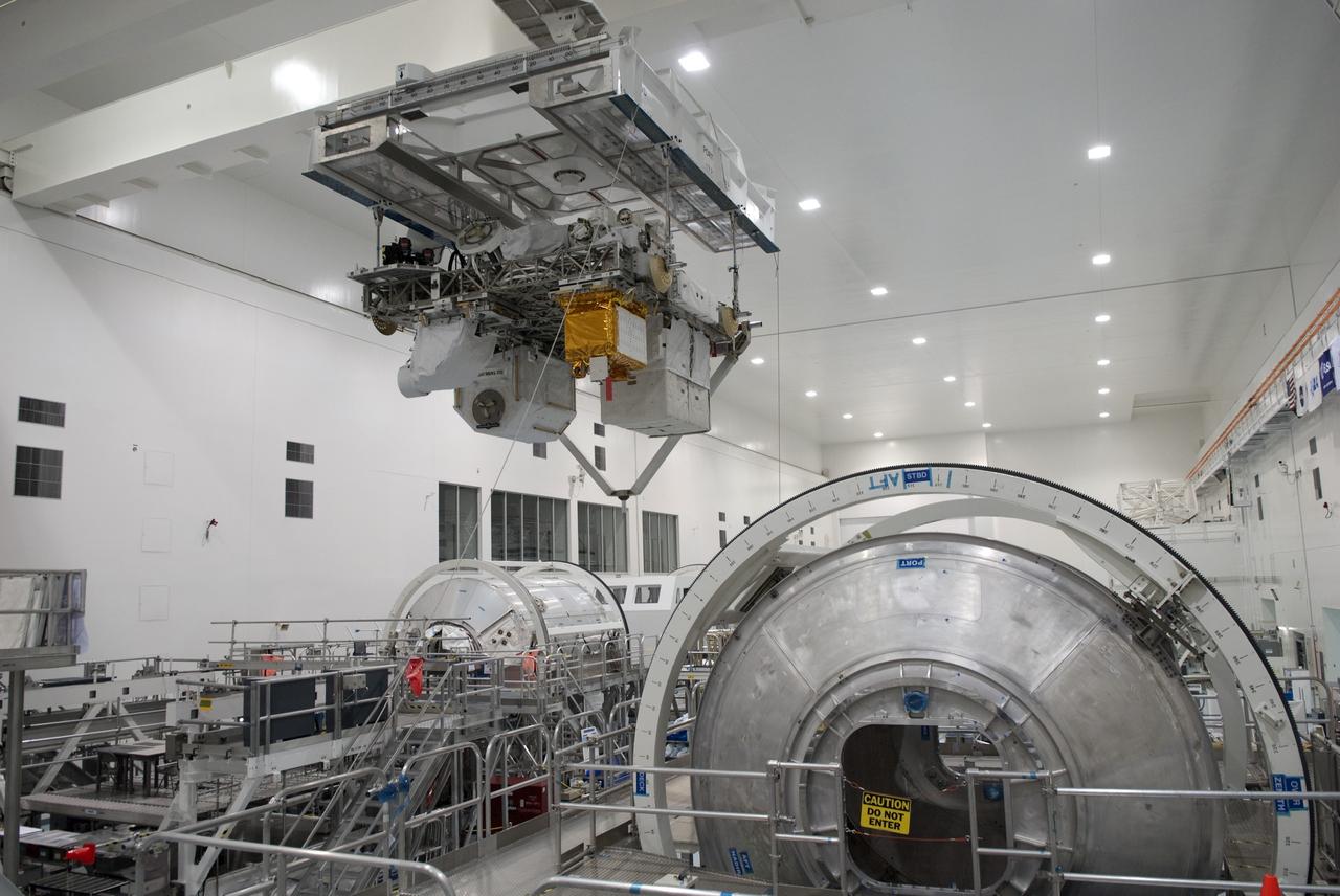 CAPE CANAVERAL, Fla. -- In the Space Station Processing Facility at NASA's Kennedy Space Center in Florida, Express Logistics Carrier-3 is moved from its primary work stand to a payload canister. The canister will protect the space-bound payload on its journey to Launch Pad 39A, where it will later be installed into space shuttle Endeavour’s payload bay. ELC-3 is packed with a variety of spare parts for the International Space Station, including two S-band communications antennas, a high-pressure gas tank, additional spare parts for Dextre and micrometeoroid debris shields. ELC-3 will fly to the station aboard Endeavour's STS-134 mission targeted to launch April 19 at 7:48 p.m. EDT. For more information visit, www.nasa.gov/mission_pages/shuttle/shuttlemissions/sts134/index.html. Photo credit: NASA/Jim Grossmann