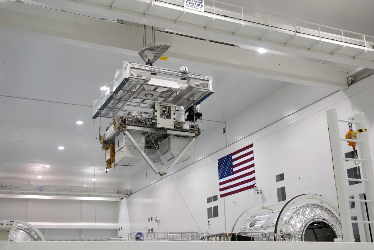 CAPE CANAVERAL, Fla. -- In the Space Station Processing Facility at NASA's Kennedy Space Center in Florida, Express Logistics Carrier-3 is moved from its primary work stand to a payload canister. The canister will protect the space-bound payload on its journey to Launch Pad 39A, where it will later be installed into space shuttle Endeavour’s payload bay. ELC-3 is packed with a variety of spare parts for the International Space Station, including two S-band communications antennas, a high-pressure gas tank, additional spare parts for Dextre and micrometeoroid debris shields. ELC-3 will fly to the station aboard Endeavour's STS-134 mission targeted to launch April 19 at 7:48 p.m. EDT. For more information visit, www.nasa.gov/mission_pages/shuttle/shuttlemissions/sts134/index.html. Photo credit: NASA/Jim Grossmann