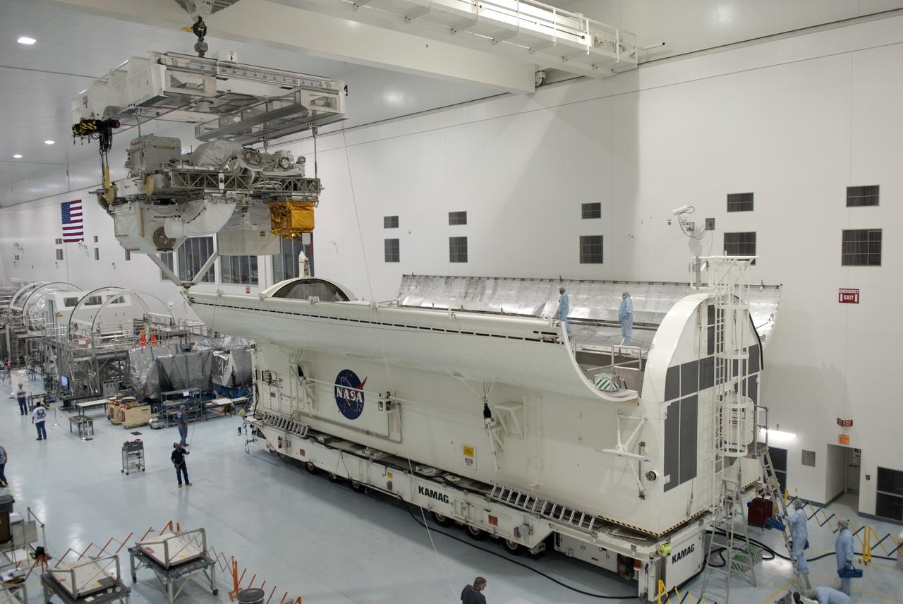 CAPE CANAVERAL, Fla. -- In the Space Station Processing Facility at NASA's Kennedy Space Center in Florida, Express Logistics Carrier-3 is moved from its primary work stand to a payload canister. The canister will protect the space-bound payload on its journey to Launch Pad 39A, where it will later be installed into space shuttle Endeavour’s payload bay. ELC-3 is packed with a variety of spare parts for the International Space Station, including two S-band communications antennas, a high-pressure gas tank, additional spare parts for Dextre and micrometeoroid debris shields. ELC-3 will fly to the station aboard Endeavour's STS-134 mission targeted to launch April 19 at 7:48 p.m. EDT. For more information visit, www.nasa.gov/mission_pages/shuttle/shuttlemissions/sts134/index.html. Photo credit: NASA/Jim Grossmann
