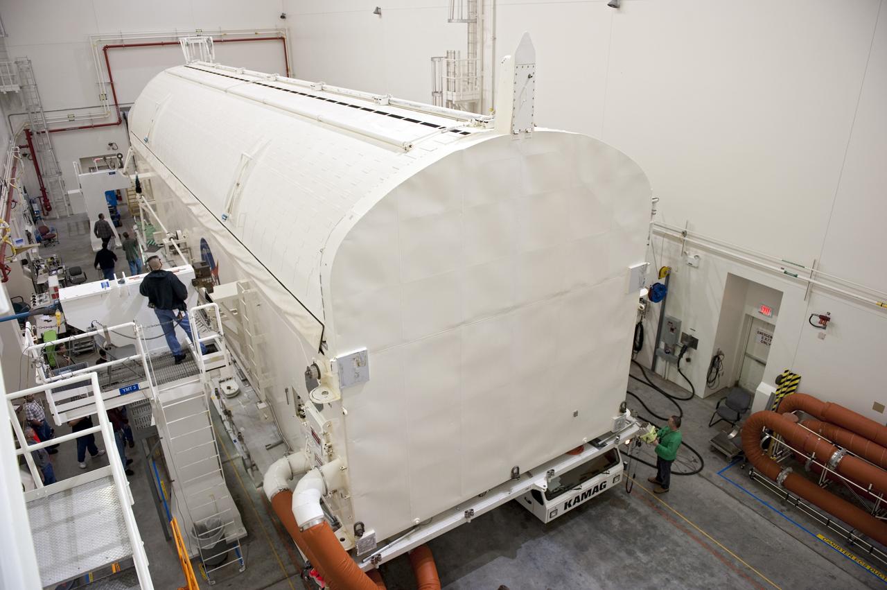 CAPE CANAVERAL, Fla. -- A canister, carrying the Alpha Magnetic Spectrometer-2 AMS and Express Logistics Carrier-3 for space shuttle Endeavour's STS-134 mission, is in the Canister Rotation Facility at NASA's Kennedy Space Center in Florida. There, the canister that protects the space-bound payload will be rotated from a horizontal to vertical position so that it can be installed into Endeavour's payload bay. AMS is a particle physics detector, designed to operate as an external experiment on the International Space Station. It will use the unique environment of space to study the universe and its origin by searching for dark matter. AMS-2 will fly to the station aboard Endeavour's STS-134 mission targeted to launch April 19 at 7:48 p.m. EDT. For more information visit, www.nasa.gov/mission_pages/shuttle/shuttlemissions/sts134/index.html. Photo credit: NASA/Kim Shiflett