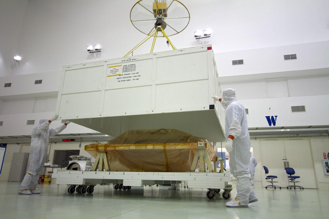 CAPE CANAVERAL, Fla. -- A solar panel that will help power NASA's Juno spacecraft on a mission to Jupiter is unpacked in the Astrotech payload processing facility in Titusville, Fla. Power-generating panels on three sets of solar arrays will extend outward from Juno’s hexagonal body, giving the overall spacecraft a span of more than 66 feet in order to operate at such a great distance from the sun. Juno is scheduled to launch aboard an Atlas V rocket from Cape Canaveral, Fla., on Aug. 5, 2011, reaching Jupiter in July 2016. The spacecraft will orbit the giant planet more than 30 times, skimming to within 3,000 miles above its cloud tops, for about one year. With its suite of science instruments, the spacecraft will investigate the existence of a solid planetary core, map Jupiter's intense magnetic field, measure the amount of water and ammonia in the deep atmosphere, and observe the planet's auroras. For more information visit, www.nasa.gov/juno. Photo credit: NASA/Jack Pfaller