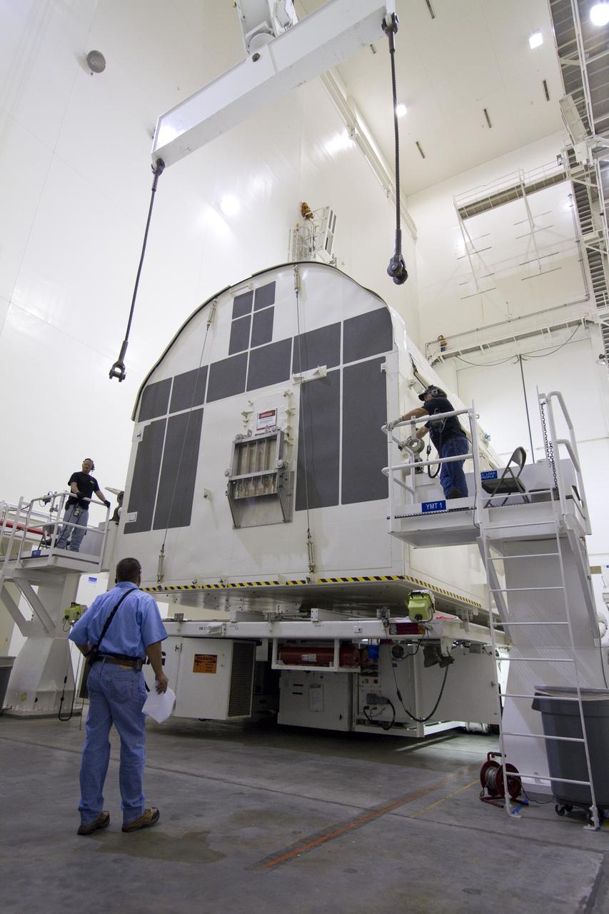 CAPE CANAVERAL, Fla. -- A canister, carrying the Alpha Magnetic Spectrometer-2 AMS and Express Logistics Carrier-3 for space shuttle Endeavour's STS-134 mission, will be rotated from a horizontal to vertical position in the Canister Rotation Facility at NASA's Kennedy Space Center in Florida. Endeavour and its six-member STS-134 crew are targeted to lift off April 19 at 7:48 p.m. EDT to deliver the payload to the International Space Station. For more information visit, www.nasa.gov/mission_pages/shuttle/shuttlemissions/sts134/index.html. Photo credit: NASA/Jack Pfaller