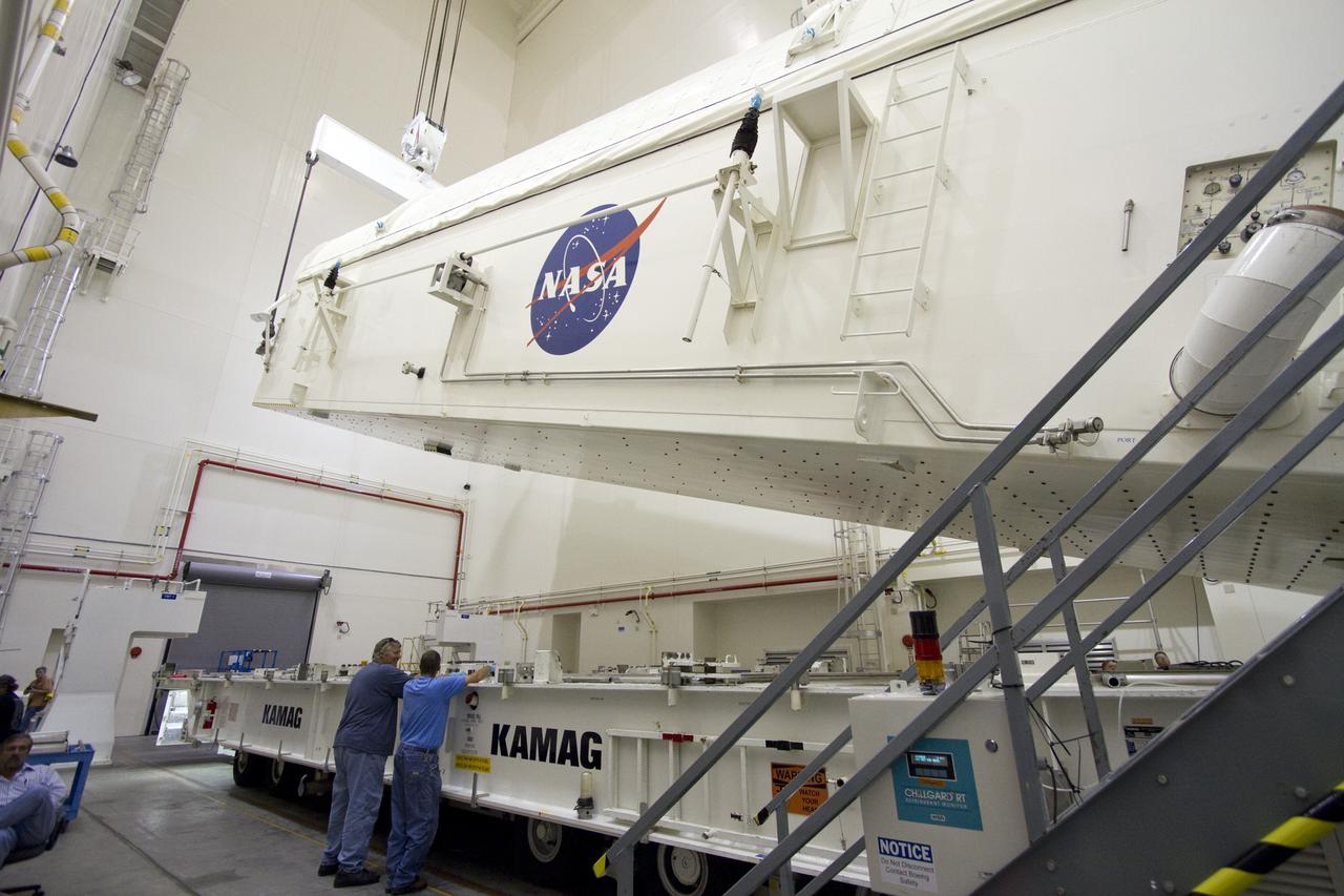 CAPE CANAVERAL, Fla. -- A canister, carrying the Alpha Magnetic Spectrometer-2 AMS and Express Logistics Carrier-3 for space shuttle Endeavour's STS-134 mission, is rotated from a horizontal to vertical position in the Canister Rotation Facility at NASA's Kennedy Space Center in Florida. Endeavour and its six-member STS-134 crew are targeted to lift off April 19 at 7:48 p.m. EDT to deliver the payload to the International Space Station. For more information visit, www.nasa.gov/mission_pages/shuttle/shuttlemissions/sts134/index.html. Photo credit: NASA/Jack Pfaller