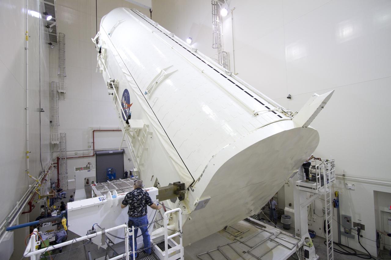 CAPE CANAVERAL, Fla. -- A canister, carrying the Alpha Magnetic Spectrometer-2 AMS and Express Logistics Carrier-3 for space shuttle Endeavour's STS-134 mission, is rotated from a horizontal to vertical position in the Canister Rotation Facility at NASA's Kennedy Space Center in Florida. Endeavour and its six-member STS-134 crew are targeted to lift off April 19 at 7:48 p.m. EDT to deliver the payload to the International Space Station. For more information visit, www.nasa.gov/mission_pages/shuttle/shuttlemissions/sts134/index.html. Photo credit: NASA/Jack Pfaller