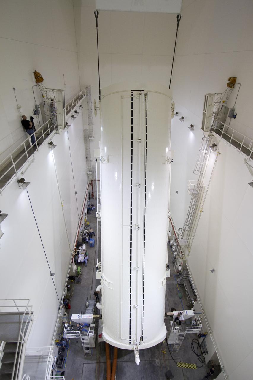 CAPE CANAVERAL, Fla. -- A canister, carrying the Alpha Magnetic Spectrometer-2 AMS and Express Logistics Carrier-3 for space shuttle Endeavour's STS-134 mission, is rotated from a horizontal to vertical position in the Canister Rotation Facility at NASA's Kennedy Space Center in Florida. Endeavour and its six-member STS-134 crew are targeted to lift off April 19 at 7:48 p.m. EDT to deliver the payload to the International Space Station. For more information visit, www.nasa.gov/mission_pages/shuttle/shuttlemissions/sts134/index.html. Photo credit: NASA/Jack Pfaller