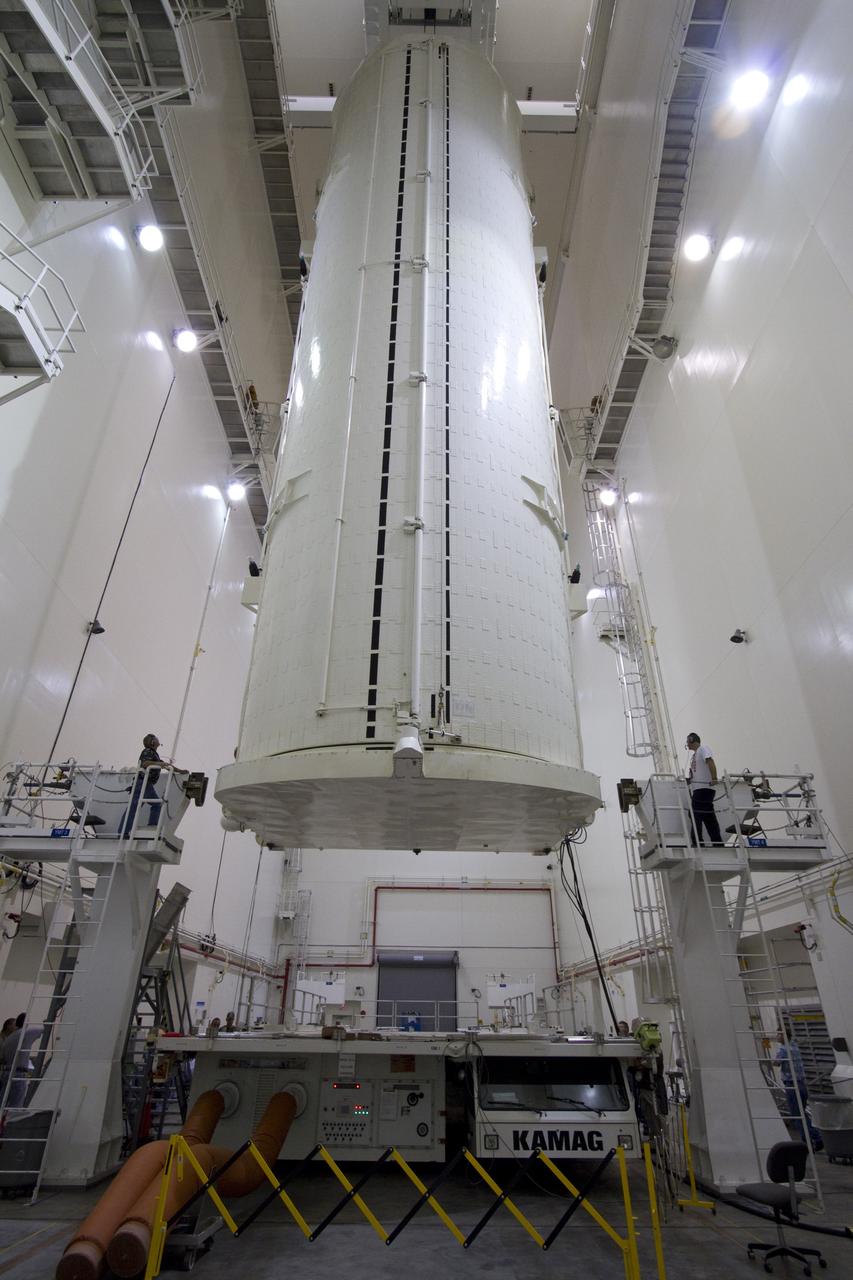 CAPE CANAVERAL, Fla. -- After being rotated from a horizontal to vertical position, the canister that contains the Alpha Magnetic Spectrometer-2 AMS and Express Logistics Carrier-3 for space shuttle Endeavour's STS-134 mission is lowered to its transportation vehicle in the Canister Rotation Facility at NASA's Kennedy Space Center in Florida. Endeavour and its six-member STS-134 crew are targeted to lift off April 19 at 7:48 p.m. EDT to deliver the payload to the International Space Station. For more information visit, www.nasa.gov/mission_pages/shuttle/shuttlemissions/sts134/index.html. Photo credit: NASA/Jack Pfaller