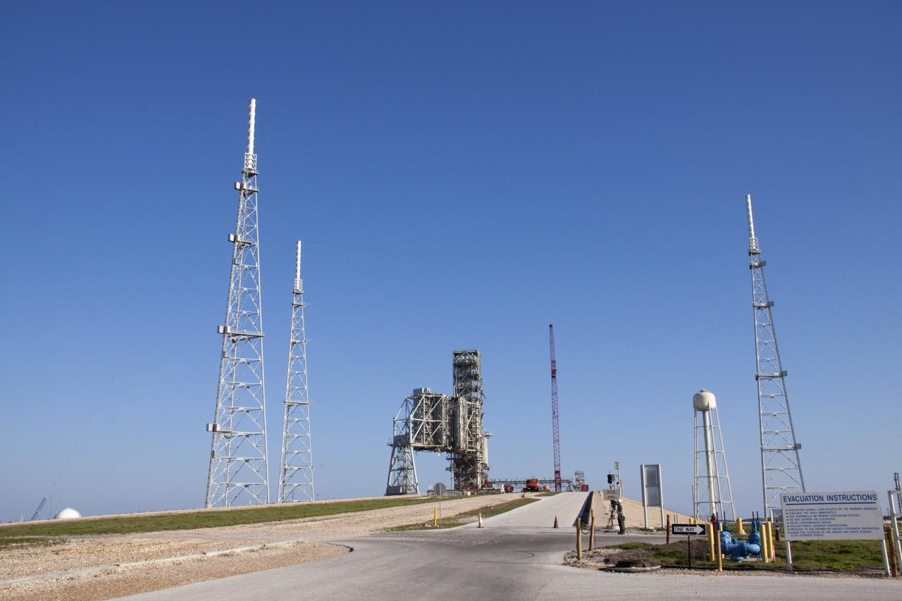 CAPE CANAVERAL, Fla. -- At NASA's Kennedy Space Center in Florida, preparations are under way to begin removing the fixed service structure FSS from Launch Pad 39B. Removal of the pad's rotating service structure RSS continues. The FSS and RSS were designed to support the unique needs of the Space Shuttle Program. In 2009, the pad was no longer needed for the shuttle program, so it is being restructured for future use.              Its new design will feature a "clean pad" for rockets to come with their own launcher, making it more versatile for a number of vehicles. The transformation also includes the refurbishment of the liquid oxygen and liquid hydrogen tanks and the upgrade of about 1.3 million feet of cable. The new lightning protection system, which was in place for the October 2009 launch of Ares I-X, will remain. For information on NASA's future plans, visit www.nasa.gov. Photo credit: NASA/Troy Cryder