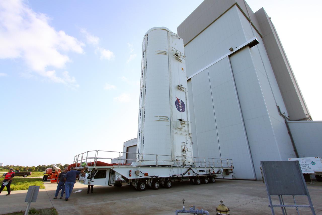 CAPE CANAVERAL, Fla. -- A canister, carrying the Alpha Magnetic Spectrometer-2 (AMS) and Express Logistics Carrier-3 for space shuttle Endeavour's STS-134 mission, is prepared for its move from the Canister Rotation Facility to Launch Pad 39A at NASA's Kennedy Space Center in Florida At the pad, crews will move the payload into the Payload Ground Handling Mechanism (PGHM), and the rotating service structure (RSS) that protects the shuttle from the elements and provides access to its components will be rotated back into place. The payload is scheduled to be installed into the shuttle's cargo bay March 25. Endeavour and its six-member STS-134 crew are targeted to lift off April 19 at 7:48 p.m. EDT to deliver the payload to the International Space Station. This is Endeavour's final scheduled mission. For more information visit, www.nasa.gov/mission_pages/shuttle/shuttlemissions/sts134/index.html. Photo credit: NASA/Jack Pfaller