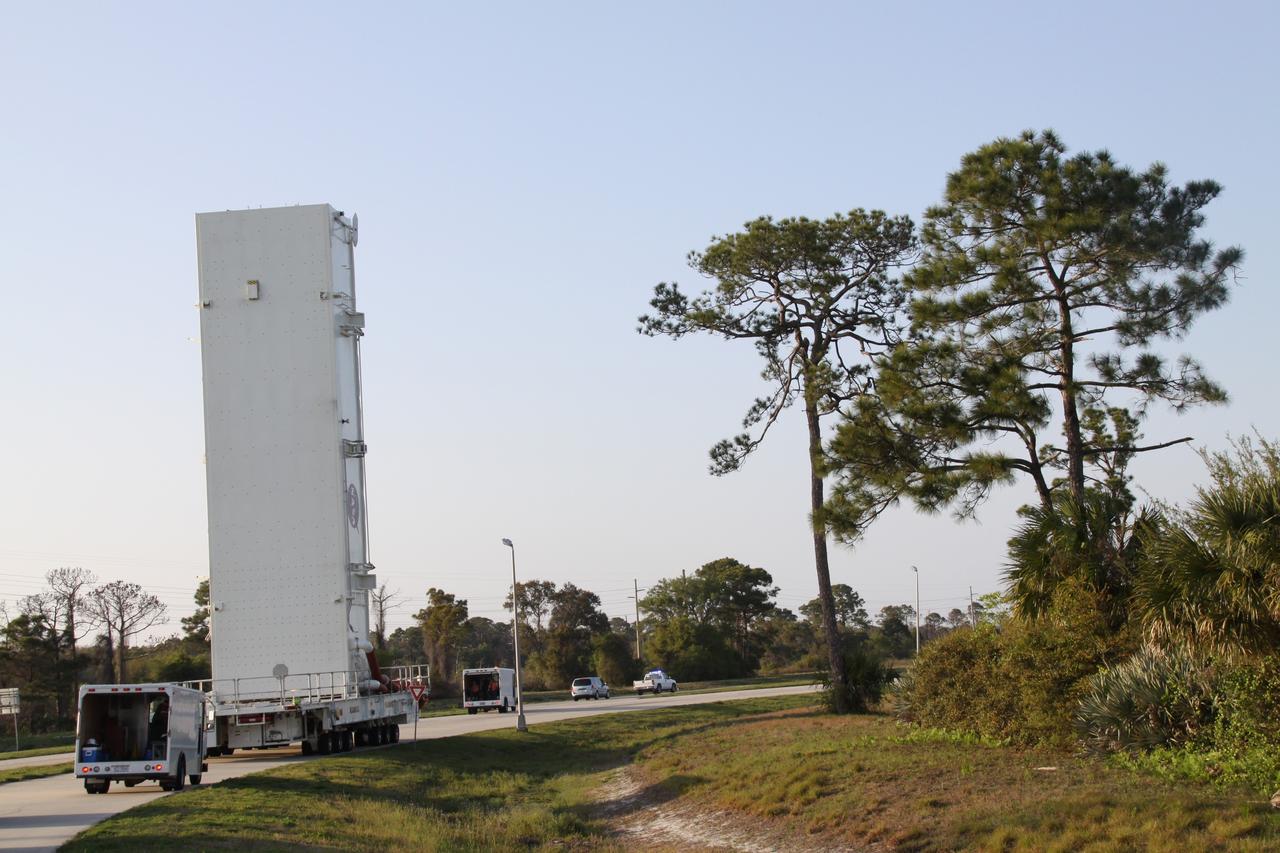 CAPE CANAVERAL, Fla. -- A canister, carrying the Alpha Magnetic Spectrometer-2 (AMS) and Express Logistics Carrier-3 for space shuttle Endeavour's STS-134 mission, is moved from the Canister Rotation Facility to Launch Pad 39A at NASA's Kennedy Space Center in Florida. At the pad, crews will move the payload into the Payload Ground Handling Mechanism (PGHM), and the rotating service structure (RSS) that protects the shuttle from the elements and provides access to its components will be rotated back into place. The payload is scheduled to be installed into the shuttle's cargo bay March 25. Endeavour and its six-member STS-134 crew are targeted to lift off April 19 at 7:48 p.m. EDT to deliver the payload to the International Space Station. This is Endeavour's final scheduled mission. For more information visit, www.nasa.gov/mission_pages/shuttle/shuttlemissions/sts134/index.html. Photo credit: NASA/Jack Pfaller
