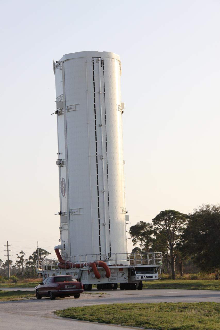 CAPE CANAVERAL, Fla. -- A canister, carrying the Alpha Magnetic Spectrometer-2 (AMS) and Express Logistics Carrier-3 for space shuttle Endeavour's STS-134 mission, is moved from the Canister Rotation Facility to Launch Pad 39A at NASA's Kennedy Space Center in Florida. At the pad, crews will move the payload into the Payload Ground Handling Mechanism (PGHM), and the rotating service structure (RSS) that protects the shuttle from the elements and provides access to its components will be rotated back into place. The payload is scheduled to be installed into the shuttle's cargo bay March 25. Endeavour and its six-member STS-134 crew are targeted to lift off April 19 at 7:48 p.m. EDT to deliver the payload to the International Space Station. This is Endeavour's final scheduled mission. For more information visit, www.nasa.gov/mission_pages/shuttle/shuttlemissions/sts134/index.html. Photo credit: NASA/Jack Pfaller