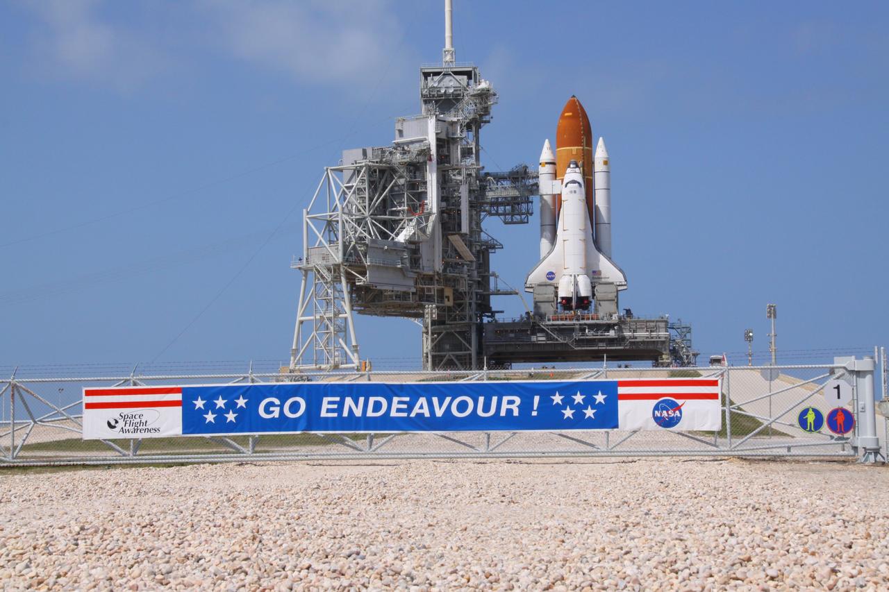 CAPE CANAVERAL, Fla. -- Space shuttle Endeavour glistens in the sun on Launch Pad 39A at NASA's Kennedy Space Center in Florida. The rotating service structure (RSS) that protects the shuttle from the elements and provides access to its components is open to allow crews to move the primary payload for Endeavour's STS-134 mission into the pad's structure before installing it into the spacecraft's cargo bay. Endeavour and its six-member STS-134 crew are targeted to lift off April 19 at 7:48 p.m. EDT to deliver the Alpha Magnetic Spectrometer-2 (AMS) and Express Logistics Carrier-3 to the International Space Station. This is Endeavour's final scheduled mission. For more information visit, www.nasa.gov/mission_pages/shuttle/shuttlemissions/sts134/index.html. Photo credit: NASA/Frank Michaux