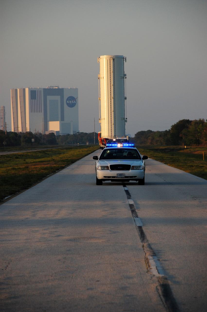 CAPE CANAVERAL, Fla. -- The canister that safely transported space shuttle Endeavour's primary payload to Launch Pad 39A at NASA's Kennedy Space Center in Florida heads back to its processing hangar, called the Canister Rotation Facility. Endeavour and its six-member STS-134 crew will deliver the Alpha Magnetic Spectrometer-2 (AMS) and Express Logistics Carrier-3 to the International Space Station. Endeavour is targeted to lift off on its final scheduled mission April 19 at 7:48 p.m. EDT. For more information visit, www.nasa.gov/mission_pages/shuttle/shuttlemissions/sts134/index.html. Photo credit: NASA/Ben Smegelsky