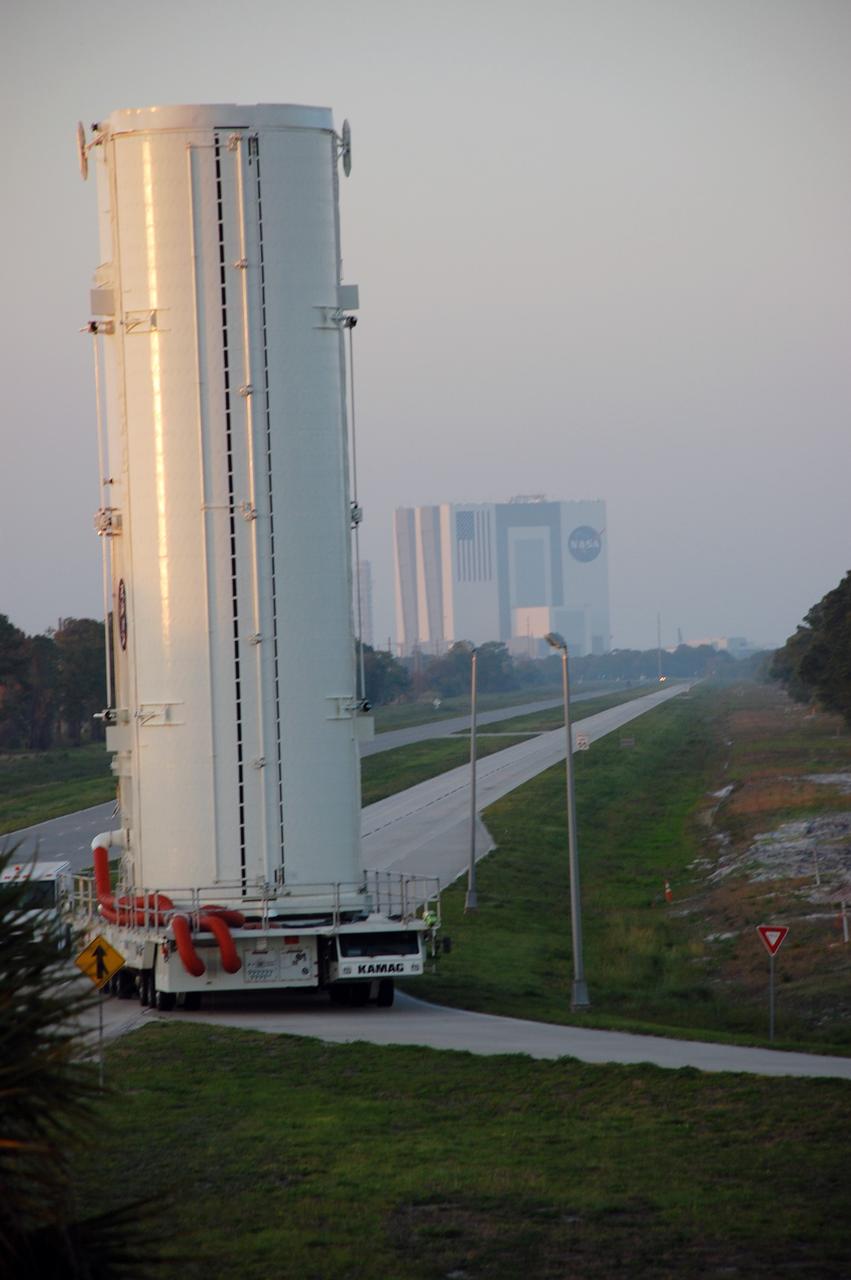 CAPE CANAVERAL, Fla. -- The canister that safely transported space shuttle Endeavour's primary payload to Launch Pad 39A at NASA's Kennedy Space Center in Florida heads back to its processing hangar, called the Canister Rotation Facility. Endeavour and its six-member STS-134 crew will deliver the Alpha Magnetic Spectrometer-2 (AMS) and Express Logistics Carrier-3 to the International Space Station. Endeavour is targeted to lift off on its final scheduled mission April 19 at 7:48 p.m. EDT. For more information visit, www.nasa.gov/mission_pages/shuttle/shuttlemissions/sts134/index.html. Photo credit: NASA/Ben Smegelsky
