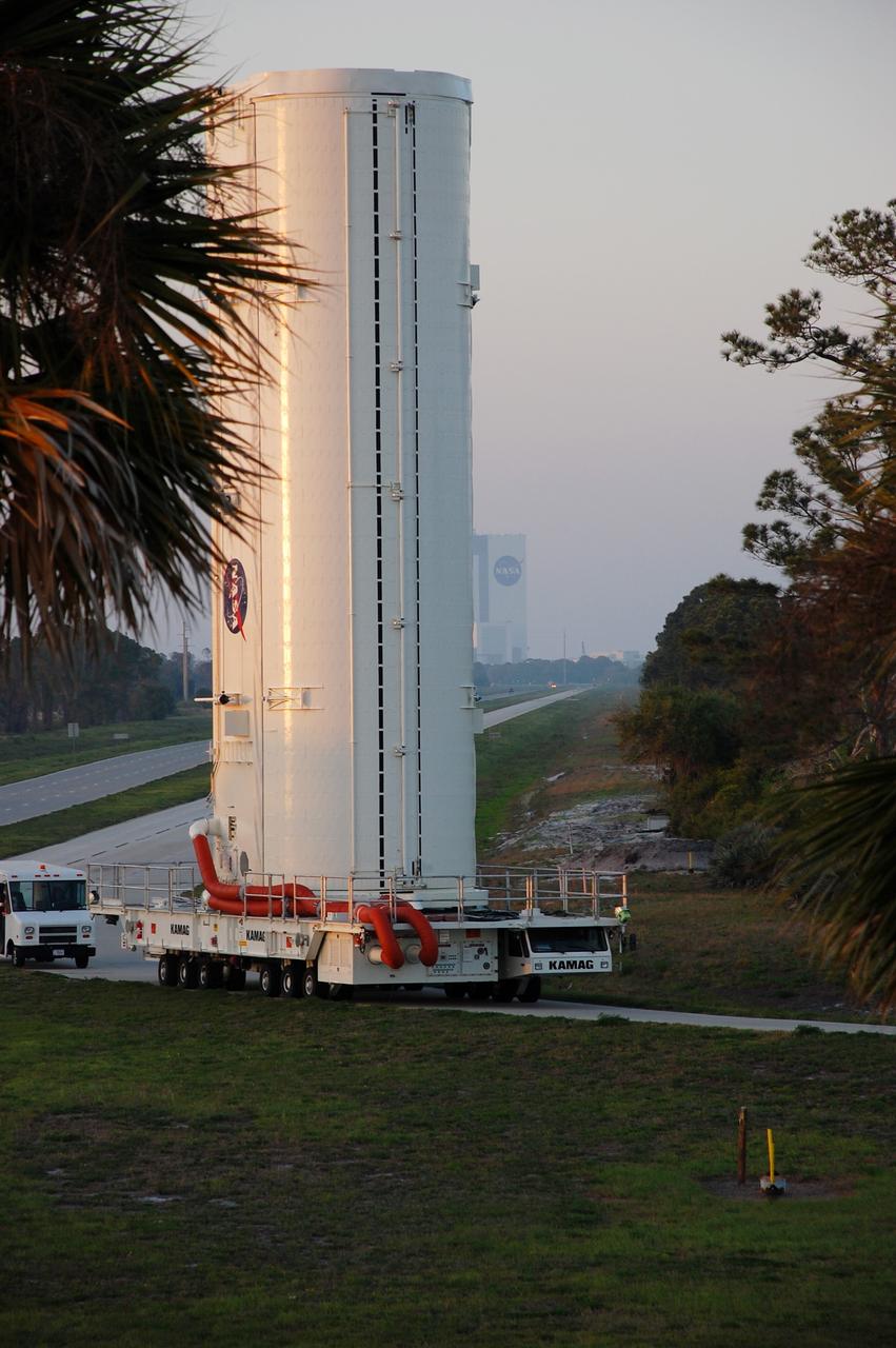 CAPE CANAVERAL, Fla. -- The canister that safely transported space shuttle Endeavour's primary payload to Launch Pad 39A at NASA's Kennedy Space Center in Florida heads back to its processing hangar, called the Canister Rotation Facility. Endeavour and its six-member STS-134 crew will deliver the Alpha Magnetic Spectrometer-2 (AMS) and Express Logistics Carrier-3 to the International Space Station. Endeavour is targeted to lift off on its final scheduled mission April 19 at 7:48 p.m. EDT. For more information visit, www.nasa.gov/mission_pages/shuttle/shuttlemissions/sts134/index.html. Photo credit: NASA/Ben Smegelsky