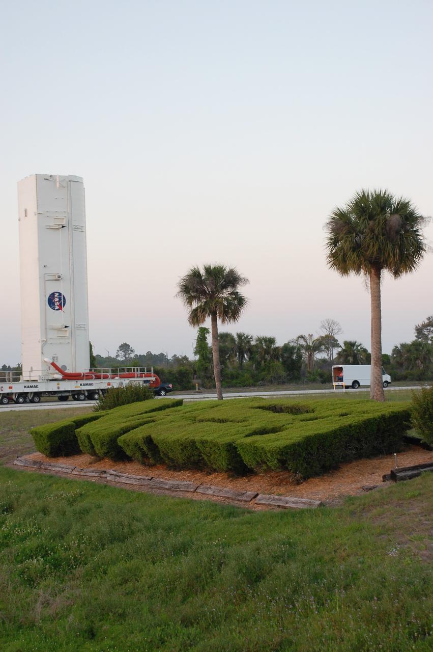 CAPE CANAVERAL, Fla. -- The canister that safely transported space shuttle Endeavour's primary payload to Launch Pad 39A at NASA's Kennedy Space Center in Florida heads back to its processing hangar, called the Canister Rotation Facility. Endeavour and its six-member STS-134 crew will deliver the Alpha Magnetic Spectrometer-2 (AMS) and Express Logistics Carrier-3 to the International Space Station. Endeavour is targeted to lift off on its final scheduled mission April 19 at 7:48 p.m. EDT. For more information visit, www.nasa.gov/mission_pages/shuttle/shuttlemissions/sts134/index.html. Photo credit: NASA/Ben Smegelsky