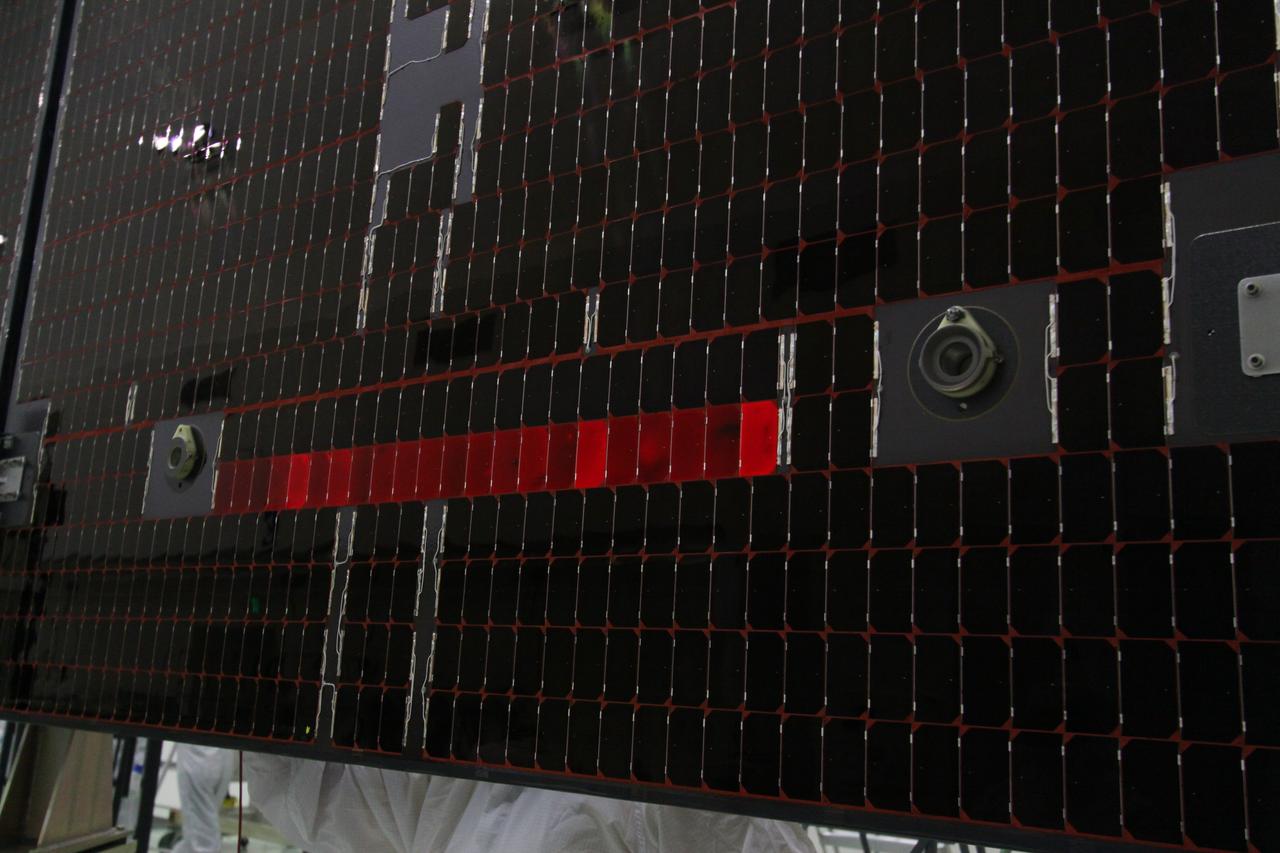 CAPE CANAVERAL, Fla. -- The electrical continuity of a solar array that will help power NASA's Juno spacecraft on a mission to Jupiter is tested in the Astrotech payload processing facility in Titusville, Fla. Power-generating panels on three sets of solar arrays will extend outward from Juno’s hexagonal body, giving the overall spacecraft a span of more than 66 feet in order to operate at such a great distance from the sun. Juno is scheduled to launch aboard an Atlas V rocket from Cape Canaveral, Fla., on Aug. 5, 2011, reaching Jupiter in July 2016. The spacecraft will orbit the giant planet more than 30 times, skimming to within 3,000 miles above its cloud tops, for about one year. With its suite of science instruments, the spacecraft will investigate the existence of a solid planetary core, map Jupiter's intense magnetic field, measure the amount of water and ammonia in the deep atmosphere, and observe the planet's auroras. For more information visit, www.nasa.gov/juno. Photo credit: NASA/Jack Pfaller