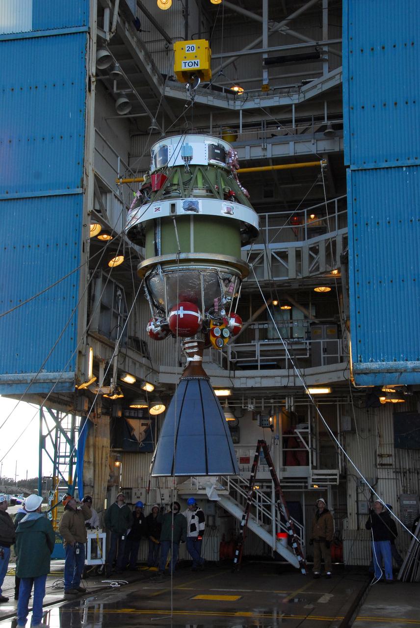 VANDENBERG AIR FORCE BASE, Calif. -- United Space Alliance technicians hoist the second stage of a Delta II rocket into position in the Space Launch Complex-2 (SLC-2) service tower at Vandenberg Air Force Base in California. The rocket is being prepared to launch NASA's Aquarius satellite into low Earth orbit.        Scheduled to launch in June, Aquarius' mission will be to provide monthly maps of global changes in sea surface salinity. By measuring ocean salinity from space, Aquarius will provide new insights into how the massive natural exchange of freshwater between the ocean, atmosphere and sea ice influences ocean circulation, weather and climate. Also going up with the satellite are optical and thermal cameras, a microwave radiometer and the SAC-D spacecraft, which were developed with the help of institutions in Italy, France, Canada and Argentina. Photo credit: VAFB/30th Space Wing