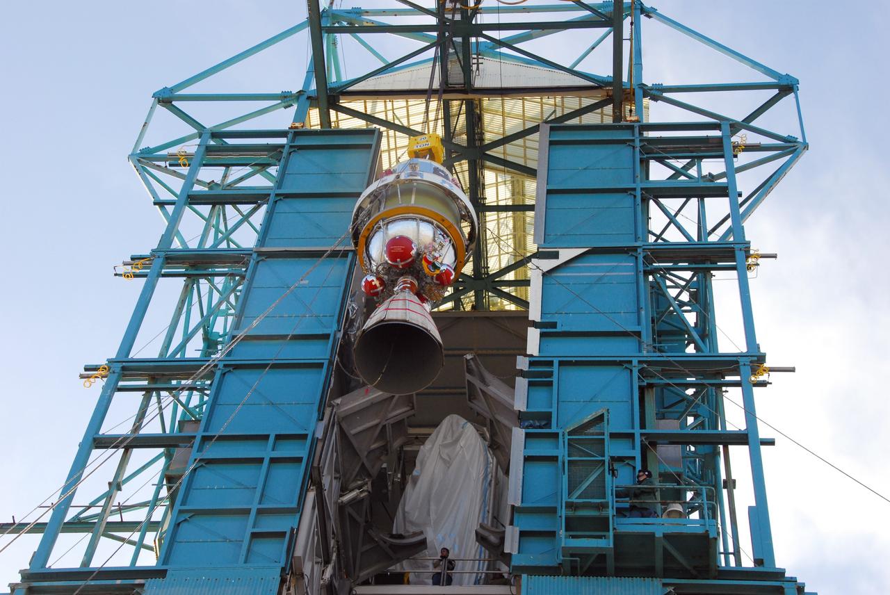 VANDENBERG AIR FORCE BASE, Calif.  -- United Space Alliance technicians hoist the second stage of a Delta II rocket into position in the Space Launch Complex-2 (SLC-2) service tower at Vandenberg Air Force Base in California. The rocket is being prepared to launch NASA's Aquarius satellite into low Earth orbit.      Scheduled to launch in June, Aquarius' mission will be to provide monthly maps of global changes in sea surface salinity. By measuring ocean salinity from space, Aquarius will provide new insights into how the massive natural exchange of freshwater between the ocean, atmosphere and sea ice influences ocean circulation, weather and climate. Also going up with the satellite are optical and thermal cameras, a microwave radiometer and the SAC-D spacecraft, which were developed with the help of institutions in Italy, France, Canada and Argentina. Photo credit: VAFB/30th Space Wing