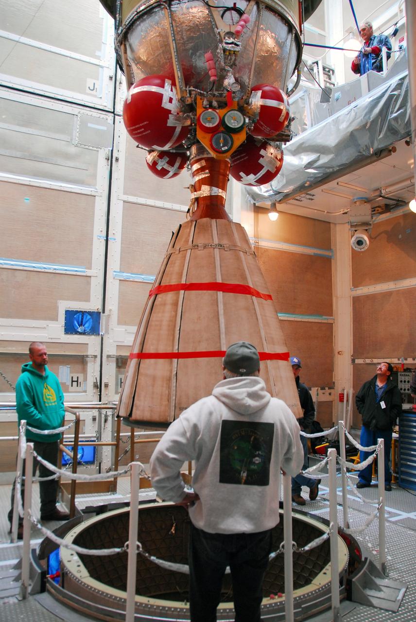 VANDENBERG AIR FORCE BASE, Calif.  -- With the Space Launch Complex-2 (SLC-2) service tower at Vandenberg Air Force Base in California back in place, United Space Alliance technicians lower the second stage of a Delta II rocket into position over the first stage. The rocket is being prepared to launch NASA's Aquarius satellite into low Earth orbit.    Scheduled to launch in June, Aquarius' mission will be to provide monthly maps of global changes in sea surface salinity. By measuring ocean salinity from space, Aquarius will provide new insights into how the massive natural exchange of freshwater between the ocean, atmosphere and sea ice influences ocean circulation, weather and climate. Also going up with the satellite are optical and thermal cameras, a microwave radiometer and the SAC-D spacecraft, which were developed with the help of institutions in Italy, France, Canada and Argentina. Photo credit: VAFB/30th Space Wing