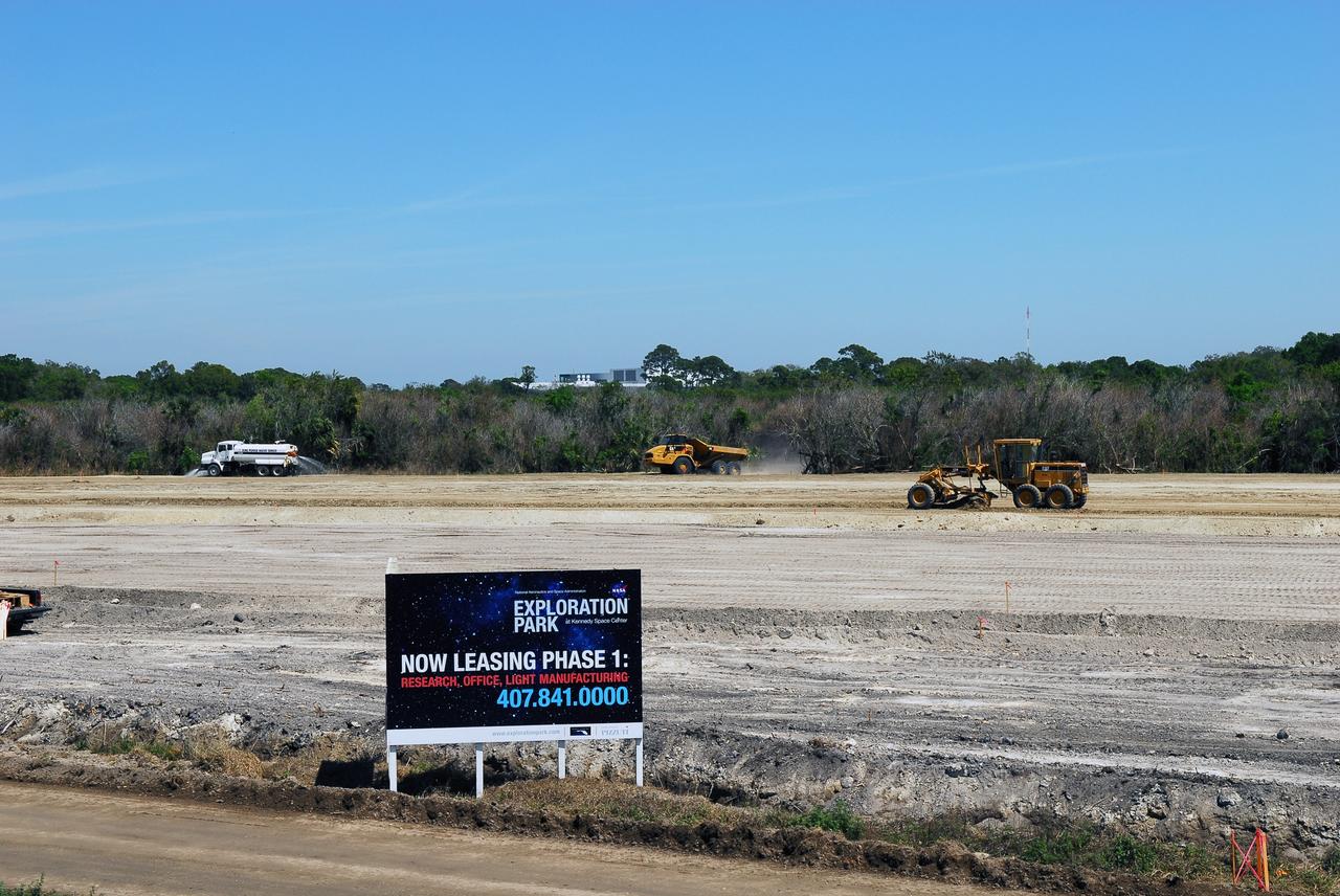 CAPE CANAVERAL, Fla. -- Crews continue to clear land and prepare for the construction of a new road at the Exploration Park site near the Space Life Sciences Laboratory (SLSL) at NASA's Kennedy Space Center in Florida. The first phase will encompass 60 acres just outside Kennedy’s security gates. Nine buildings will provide 350,000-square feet of work space, including educational, office, research and lab, and high-bay facilities. Each building is expected to be certified in the U.S. Green Building Council’s Leadership in Environmental and Energy Design (LEED).      Exploration Park is designed to be a strategically located complex, adjacent to the SLSL, for servicing diverse tenants and uses that will engage in activities to support space-related activities of NASA, other government agencies and the U.S. commercial space industry. It also is expected to bring new aerospace work to the Space Coast. The SLSL will be the anchor facility for the park, which is expected to open its first new facility in early 2012. Photo credit: NASA/Jim Grossmann
