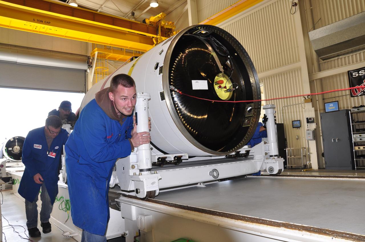 VANDENBERG AIR FORCE BASE, Calif. -- The first, second and third stages of the Orbital Sciences Corp. Pegasus XL rocket that will launch the Nuclear Spectroscopic Telescope Array NuSTAR to orbit are moved from the west high bay to the east high bay of Building 1555 at Vandenberg Air Force Base in California. The move will allow technicians to process the spacecraft and fairing in the clean rooms of the east high bay before attaching it to the rocket. After the rocket and spacecraft are processed at Vandenberg, they will be flown on the Orbital Sciences' L-1011 carrier aircraft to the Ronald Reagan Ballistic Missile Defense Test Site located at the Pacific Ocean’s Kwajalein Atoll for launch. The high-energy X-ray telescope will conduct a census for black holes, map radioactive material in young supernovae remnants, and study the origins of cosmic rays and the extreme physics around collapsed stars. Photo credit: NASA/Randy Beaudoin, VAFB