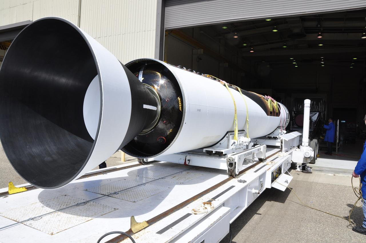 VANDENBERG AIR FORCE BASE, Calif. -- The first, second and third stages of the Orbital Sciences Corp. Pegasus XL rocket that will launch the Nuclear Spectroscopic Telescope Array NuSTAR to orbit are moved from the west high bay to the east high bay of Building 1555 at Vandenberg Air Force Base in California. The move will allow technicians to process the spacecraft and fairing in the clean rooms of the east high bay before attaching it to the rocket. After the rocket and spacecraft are processed at Vandenberg, they will be flown on the Orbital Sciences' L-1011 carrier aircraft to the Ronald Reagan Ballistic Missile Defense Test Site located at the Pacific Ocean’s Kwajalein Atoll for launch. The high-energy X-ray telescope will conduct a census for black holes, map radioactive material in young supernovae remnants, and study the origins of cosmic rays and the extreme physics around collapsed stars. Photo credit: NASA/Randy Beaudoin, VAFB