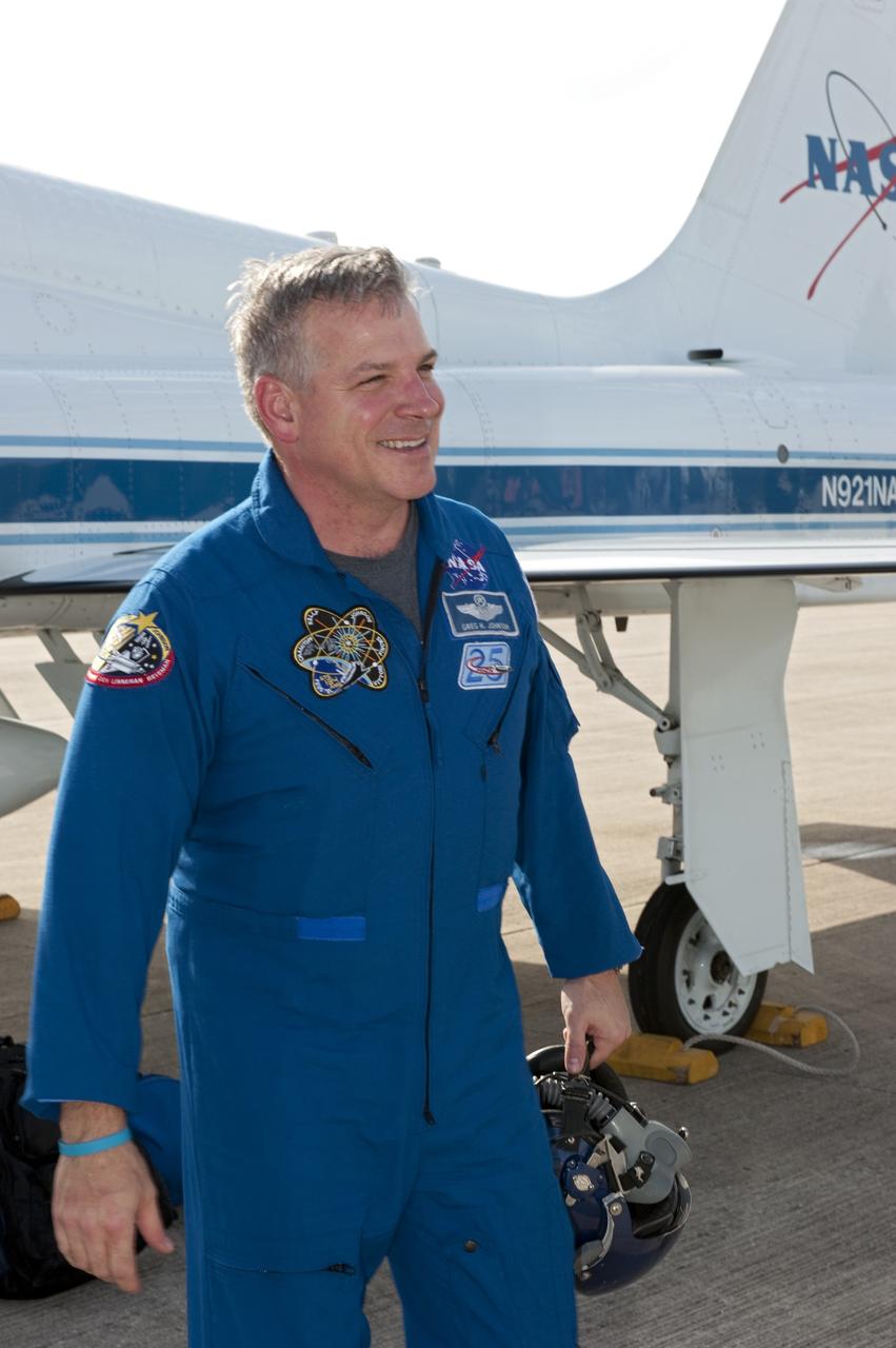 CAPE CANAVERAL, Fla. -- STS-134 Pilot Greg H. Johnson stands in front of a T-38 jet on the Shuttle Landing Facility at NASA's Kennedy Space Center in Florida. While at Kennedy, space shuttle Endeavour's crew will participate in a launch countdown dress rehearsal called the Terminal Countdown Demonstration Test (TCDT) and related training in preparation for the upcoming STS-134 mission. Endeavour and its six STS-134 crew members will deliver the Express Logistics Carrier-3, Alpha Magnetic Spectrometer-2 (AMS), a high-pressure gas tank, additional spare parts for the Dextre robotic helper and micrometeoroid debris shields to the International Space Station. This will be the final spaceflight for Endeavour. Launch is targeted for April 19 at 7:48 p.m. EDT. For more information visit, www.nasa.gov/mission_pages/shuttle/shuttlemissions/sts134/index.html. Photo credit: NASA/Kim Shiflett