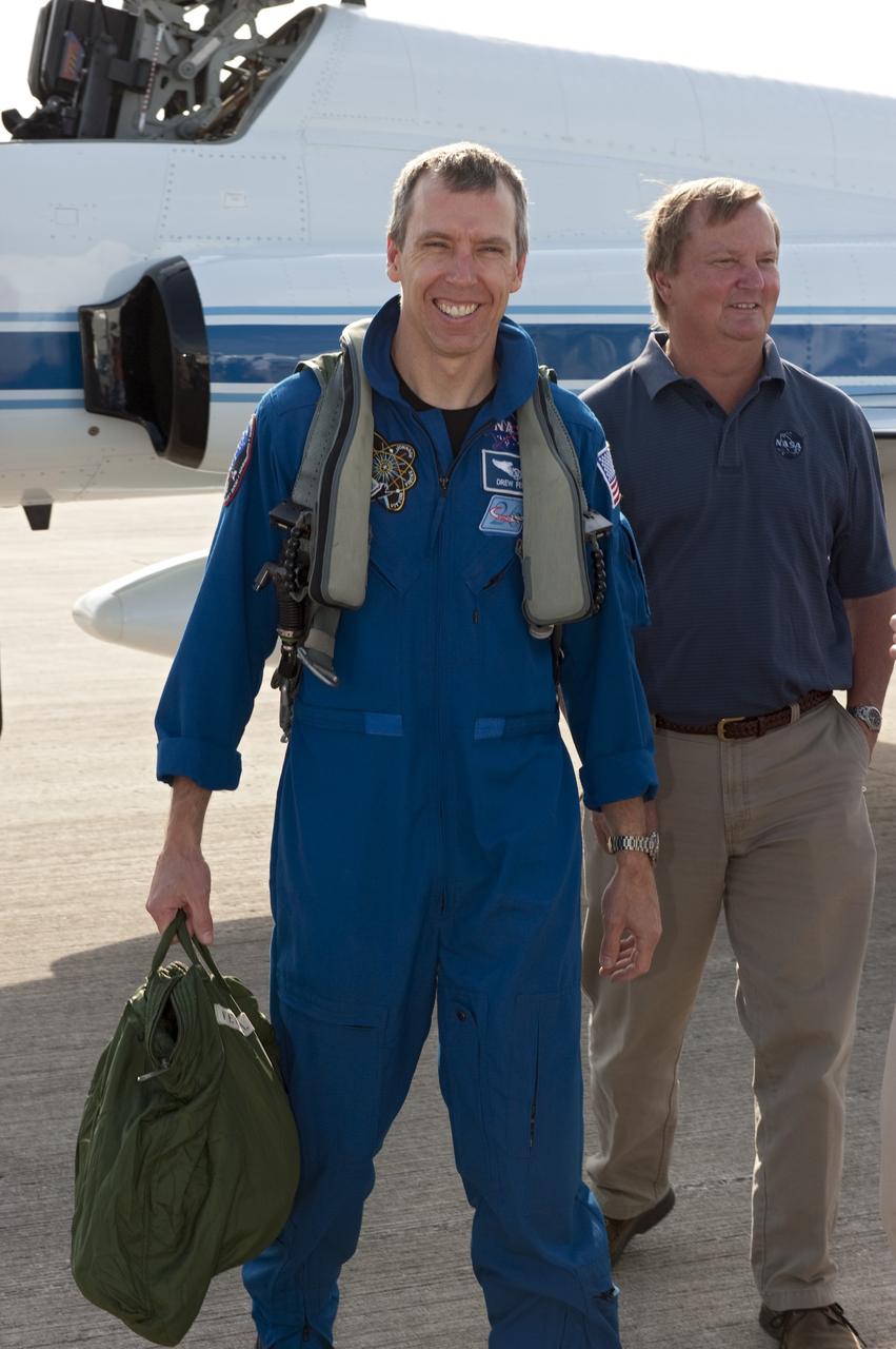 CAPE CANAVERAL, Fla. -- Shuttle Launch Director Mike Leinbach, right, is on hand to greet STS-134 Mission Specialist Andrew Feustel who arrived on the Shuttle Landing Facility at NASA's Kennedy Space Center in Florida aboard a T-38 jet. While at Kennedy, space shuttle Endeavour's crew will participate in a launch countdown dress rehearsal called the Terminal Countdown Demonstration Test (TCDT) and related training in preparation for the upcoming STS-134 mission. Endeavour and its six STS-134 crew members will deliver the Express Logistics Carrier-3, Alpha Magnetic Spectrometer-2 (AMS), a high-pressure gas tank, additional spare parts for the Dextre robotic helper and micrometeoroid debris shields to the International Space Station. This will be the final spaceflight for Endeavour. Launch is targeted for April 19 at 7:48 p.m. EDT. For more information visit, www.nasa.gov/mission_pages/shuttle/shuttlemissions/sts134/index.html. Photo credit: NASA/Kim Shiflett