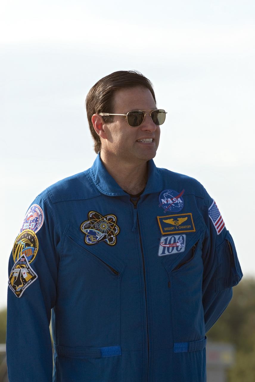 CAPE CANAVERAL, Fla. -- STS-134 Mission Specialist Greg Chamitoff listens to Commander Mark Kelly address the media on the Shuttle Landing Facility at NASA's Kennedy Space Center in Florida. While at Kennedy, space shuttle Endeavour's crew will participate in a launch countdown dress rehearsal called the Terminal Countdown Demonstration Test (TCDT) and related training in preparation for the upcoming STS-134 mission. Endeavour and its six STS-134 crew members will deliver the Express Logistics Carrier-3, Alpha Magnetic Spectrometer-2 (AMS), a high-pressure gas tank, additional spare parts for the Dextre robotic helper and micrometeoroid debris shields to the International Space Station. This will be the final spaceflight for Endeavour. Launch is targeted for April 19 at 7:48 p.m. EDT. For more information visit, www.nasa.gov/mission_pages/shuttle/shuttlemissions/sts134/index.html. Photo credit: NASA/Kim Shiflett