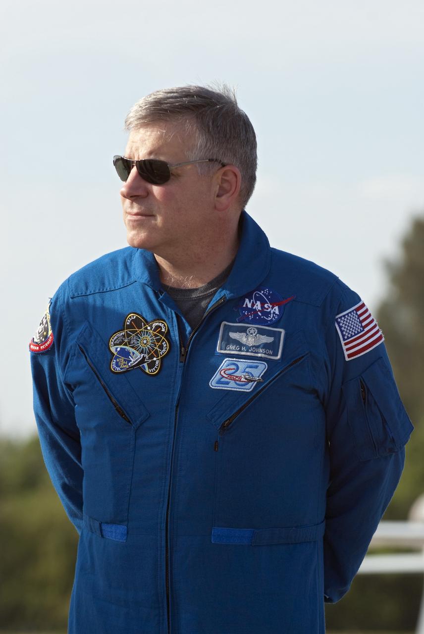 CAPE CANAVERAL, Fla. -- STS-134 Pilot Greg H. Johnson listens to Commander Mark Kelly address the media on the Shuttle Landing Facility at NASA's Kennedy Space Center in Florida. While at Kennedy, space shuttle Endeavour's crew will participate in a launch countdown dress rehearsal called the Terminal Countdown Demonstration Test (TCDT) and related training in preparation for the upcoming STS-134 mission.         Endeavour and its six STS-134 crew members will deliver the Express Logistics Carrier-3, Alpha Magnetic Spectrometer-2 (AMS), a high-pressure gas tank, additional spare parts for the Dextre robotic helper and micrometeoroid debris shields to the International Space Station. This will be the final spaceflight for Endeavour. Launch is targeted for April 19 at 7:48 p.m. EDT. For more information visit, www.nasa.gov/mission_pages/shuttle/shuttlemissions/sts134/index.html. Photo credit: NASA/Kim Shiflett