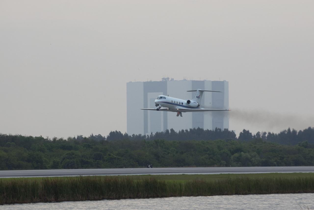 CAPE CANAVERAL, Fla. -- STS-134 Commander Mark Kelly performs touch-and-go landings aboard a Shuttle Training Aircraft (STA) on the Shuttle Landing Facility at NASA's Kennedy Space Center in Florida. STAs are Gulfstream II business jets that are modified to mimic the shuttle's handling during the final phase of landing. Practice landings are part of standard training before space shuttle Endeavour's upcoming STS-134 launch to the International Space Station. Endeavour's six crew members are at Kennedy for the launch countdown dress rehearsal called the Terminal Countdown Demonstration Test (TCDT) and related training. Targeted to launch April 19 at 7:48 p.m. EDT, they will deliver the Express Logistics Carrier-3, Alpha Magnetic Spectrometer-2 (AMS), a high-pressure gas tank, additional spare parts for the Dextre robotic helper and micrometeoroid debris shields to the space station. This will be the final spaceflight for Endeavour. For more information visit, www.nasa.gov/mission_pages/shuttle/shuttlemissions/sts134/index.html. Photo credit: NASA/Kim Shiflett