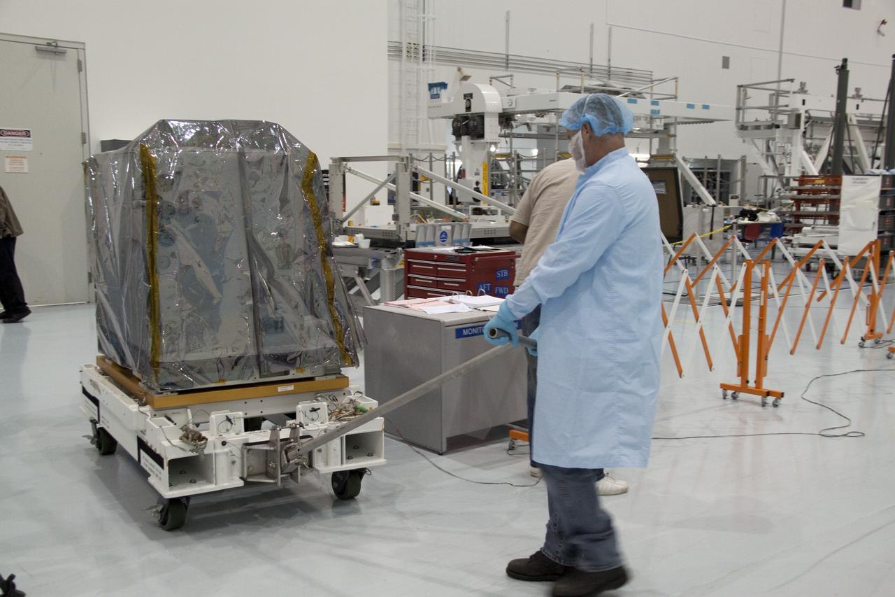 CAPE CANAVERAL, Fla. -- Technicians move a system that will investigate the potential for robotically refueling existing spacecraft in orbit from a processing lab to a high bay in the Space Station Processing Facility at NASA's Kennedy Space Center in Florida. The move prepares the system for its lift into the Lightweight Multi-Purpose Experiment Support Structure Carrier (LMC), which will carry it into orbit. Called the Robotic Refueling Mission (RRM), the system will be processed to fly aboard space shuttle Atlantis on the STS-135 mission to the International Space Station. Also going up will be the Raffaello multipurpose logistics module packed with supplies, logistics and spare parts. The mission also will return a failed ammonia pump module to help NASA better understand the failure mechanism and improve pump designs for future systems. STS-135, targeted to launch June 28, will be the 33rd flight of Atlantis, the 37th shuttle mission to the space station, and the 135th and final mission of NASA's Space Shuttle Program. For more information visit, www.nasa.gov/mission_pages/shuttle/shuttlemissions/sts135/index.html. Photo credit: NASA/Jack Pfaller