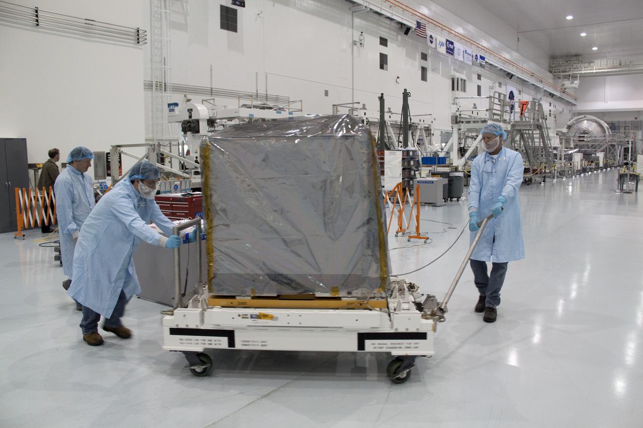 CAPE CANAVERAL, Fla. -- Technicians move a system that will investigate the potential for robotically refueling existing spacecraft in orbit from a processing lab to a high bay in the Space Station Processing Facility at NASA's Kennedy Space Center in Florida. The move prepares the system for its lift into the Lightweight Multi-Purpose Experiment Support Structure Carrier (LMC), which will carry it into orbit. Called the Robotic Refueling Mission (RRM), the system will be processed to fly aboard space shuttle Atlantis on the STS-135 mission to the International Space Station. Also going up will be the Raffaello multipurpose logistics module packed with supplies, logistics and spare parts. The mission also will return a failed ammonia pump module to help NASA better understand the failure mechanism and improve pump designs for future systems. STS-135, targeted to launch June 28, will be the 33rd flight of Atlantis, the 37th shuttle mission to the space station, and the 135th and final mission of NASA's Space Shuttle Program. For more information visit, www.nasa.gov/mission_pages/shuttle/shuttlemissions/sts135/index.html. Photo credit: NASA/Jack Pfaller