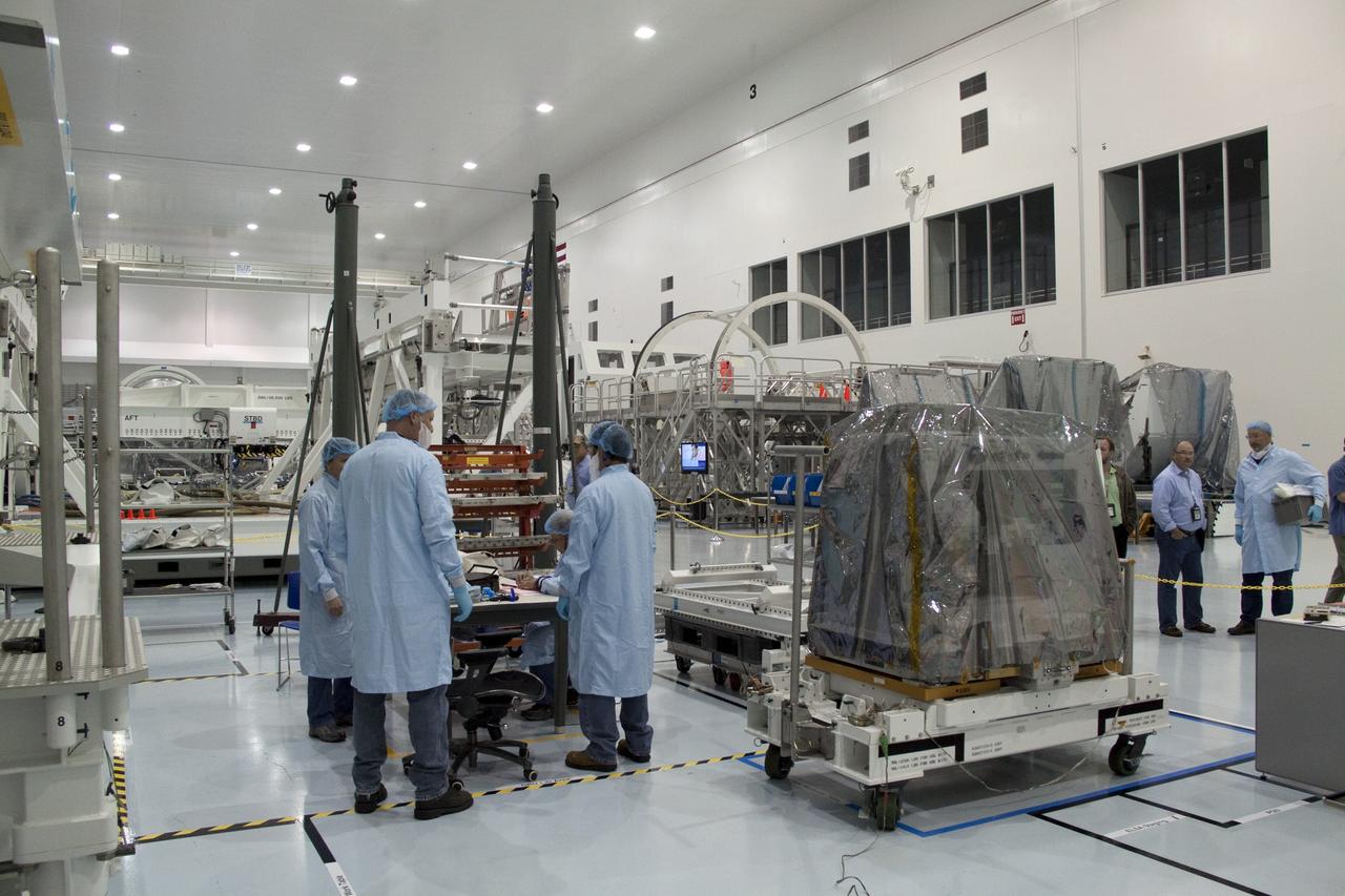 CAPE CANAVERAL, Fla. -- Technicians move a system that will investigate the potential for robotically refueling existing spacecraft in orbit from a processing lab to a high bay in the Space Station Processing Facility at NASA's Kennedy Space Center in Florida. The move prepares the system for its lift into the Lightweight Multi-Purpose Experiment Support Structure Carrier (LMC), which will carry it into orbit. Called the Robotic Refueling Mission (RRM), the system will be processed to fly aboard space shuttle Atlantis on the STS-135 mission to the International Space Station. Also going up will be the Raffaello multipurpose logistics module packed with supplies, logistics and spare parts. The mission also will return a failed ammonia pump module to help NASA better understand the failure mechanism and improve pump designs for future systems. STS-135, targeted to launch June 28, will be the 33rd flight of Atlantis, the 37th shuttle mission to the space station, and the 135th and final mission of NASA's Space Shuttle Program. For more information visit, www.nasa.gov/mission_pages/shuttle/shuttlemissions/sts135/index.html. Photo credit: NASA/Jack Pfaller