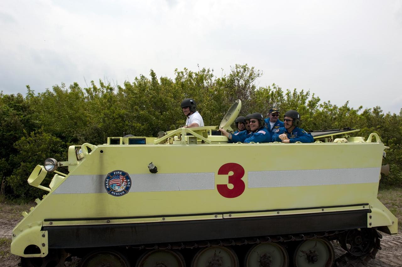 CAPE CANAVERAL, Fla. - Space shuttle Endeavour's STS-134 crew members participate in M113 armored personnel carrier training at NASA's Kennedy Space Center in Florida. An M113 is kept at the foot of the launch pad in case an emergency exit from the pad is needed and every shuttle crew is trained on driving the vehicle before launch.           Endeavour's six crew members are at Kennedy for the launch countdown dress rehearsal called the Terminal Countdown Demonstration Test (TCDT) and related training. Targeted to launch April 19 at 7:48 p.m. EDT, they will deliver the Express Logistics Carrier-3, Alpha Magnetic Spectrometer-2 (AMS), a high-pressure gas tank, additional spare parts for the Dextre robotic helper and micrometeoroid debris shields to the space station. This will be the final spaceflight for Endeavour. For more information visit, www.nasa.gov/mission_pages/shuttle/shuttlemissions/sts134/index.html. Photo credit: NASA/Kim Shiflett