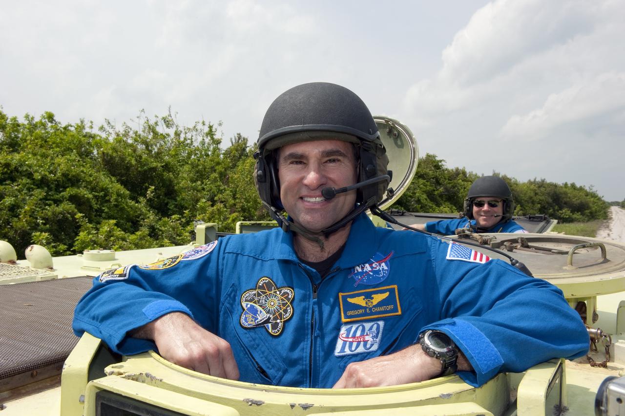 CAPE CANAVERAL, Fla. - At NASA's Kennedy Space Center in Florida, STS-134 Mission Specialist Greg Chamitoff prepares to drive an M113 armored personnel carrier. An M113 is kept at the foot of the launch pad in case an emergency exit from the pad is needed and every shuttle crew is trained on driving the vehicle before launch. Space shuttle Endeavour's six crew members are at Kennedy for the launch countdown dress rehearsal called the Terminal Countdown Demonstration Test (TCDT) and related training. Targeted to launch April 19 at 7:48 p.m. EDT, they will deliver the Express Logistics Carrier-3, Alpha Magnetic Spectrometer-2 (AMS), a high-pressure gas tank, additional spare parts for the Dextre robotic helper and micrometeoroid debris shields to the space station. This will be the final spaceflight for Endeavour. For more information visit, www.nasa.gov/mission_pages/shuttle/shuttlemissions/sts134/index.html. Photo credit: NASA/Kim Shiflett