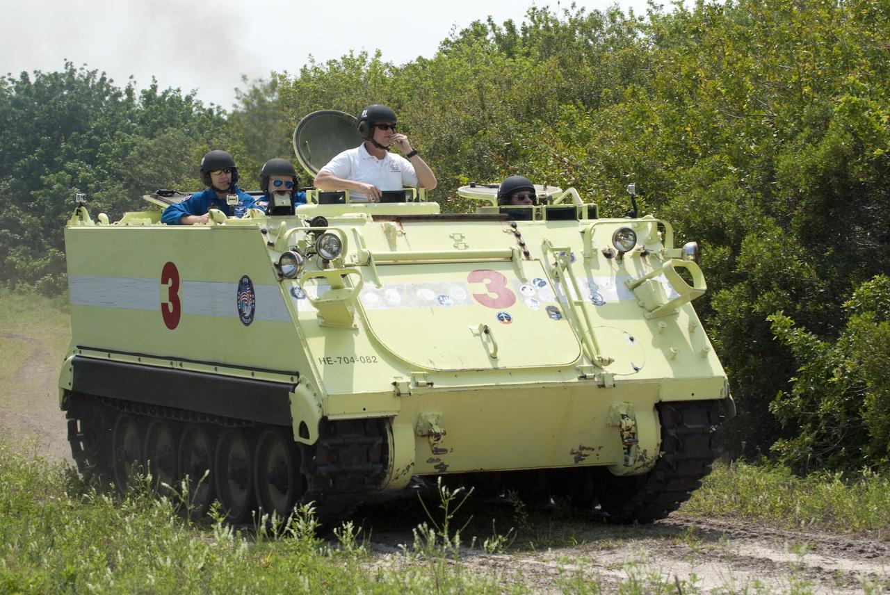 CAPE CANAVERAL, Fla. - Battalion Chief David Seymour provides supervision while space shuttle Endeavour's STS-134 crew members participate in M113 armored personnel carrier training at NASA's Kennedy Space Center in Florida. An M113 is kept at the foot of the launch pad in case an emergency exit from the pad is needed and every shuttle crew is trained on driving the vehicle before launch. Space shuttle Endeavour's six crew members are at Kennedy for the launch countdown dress rehearsal called the Terminal Countdown Demonstration Test (TCDT) and related training. Targeted to launch April 19 at 7:48 p.m. EDT, they will deliver the Express Logistics Carrier-3, Alpha Magnetic Spectrometer-2 (AMS), a high-pressure gas tank, additional spare parts for the Dextre robotic helper and micrometeoroid debris shields to the space station. This is the final scheduled spaceflight for Endeavour. For more information visit, www.nasa.gov/mission_pages/shuttle/shuttlemissions/sts134/index.html. Photo credit: NASA/Kim Shiflett